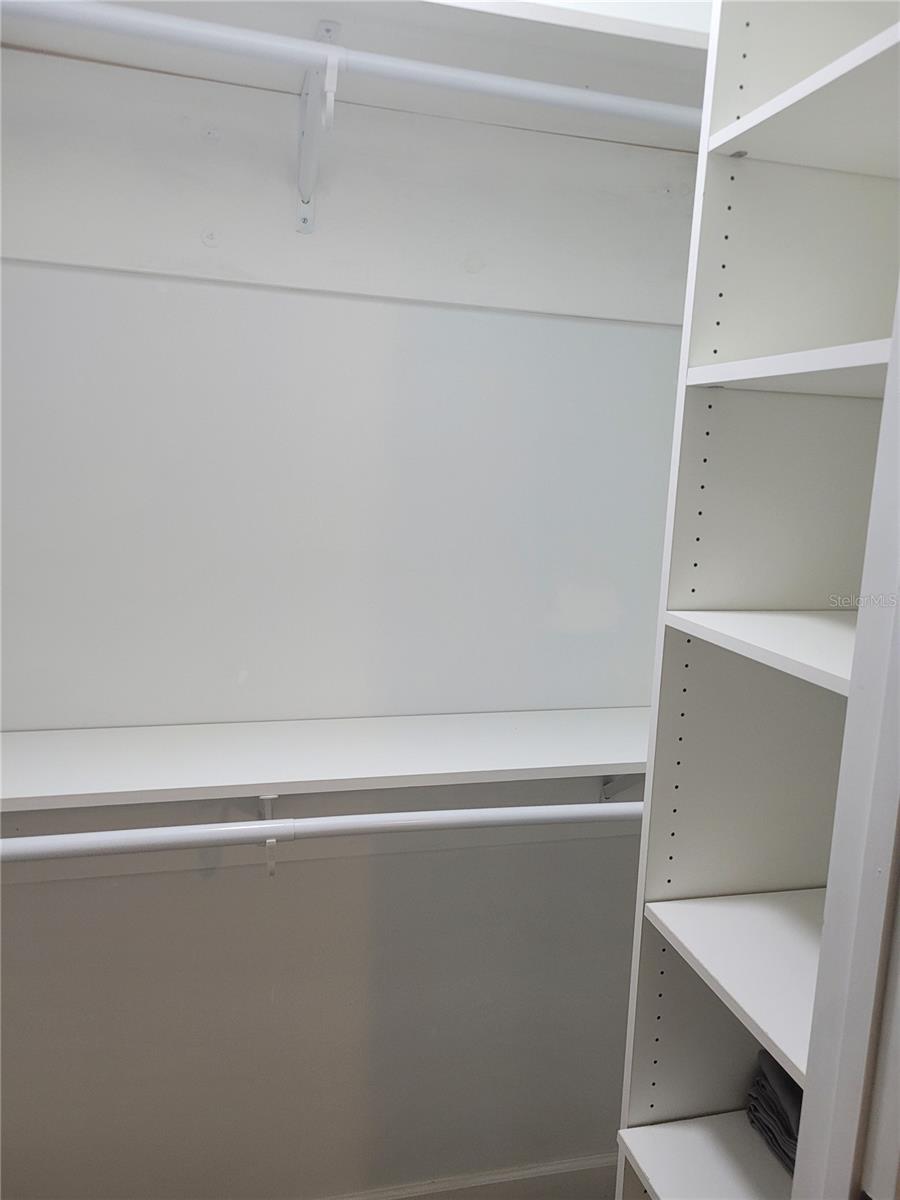 Walk in closet with built in shelves