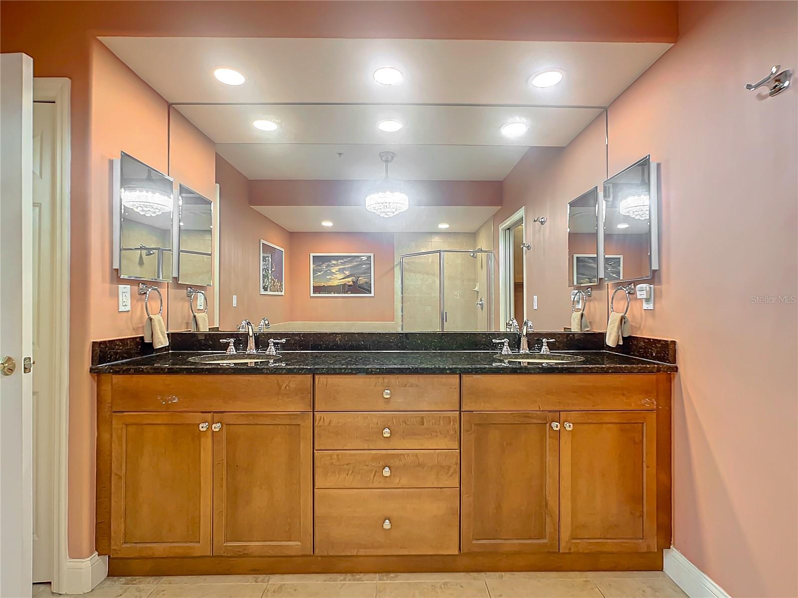 Having a double vanity and ample counter space is so important in a primary bathroom