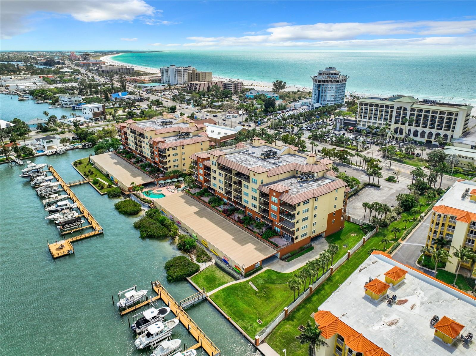 This aerial view depicts the nice location of the community.  There is green space for walking dogs and just enjoying yourself besides having 2 sets of boat slips and the fishing pier.