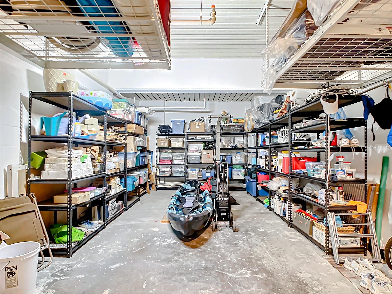 This is a closer look at how much room there is in the garage for storage, notice the overhead storage racks, so even if you have 2 cars you have storage space.