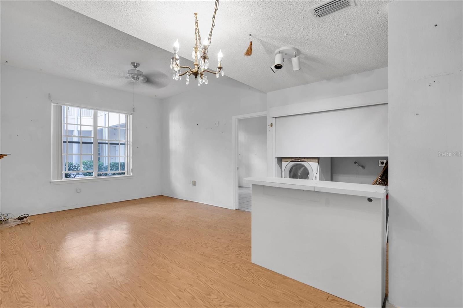 From in kitchen. A lot of nice angles to view unit so you can get ideas! Laundry closet currently has a pull down shade to close off when not in use.