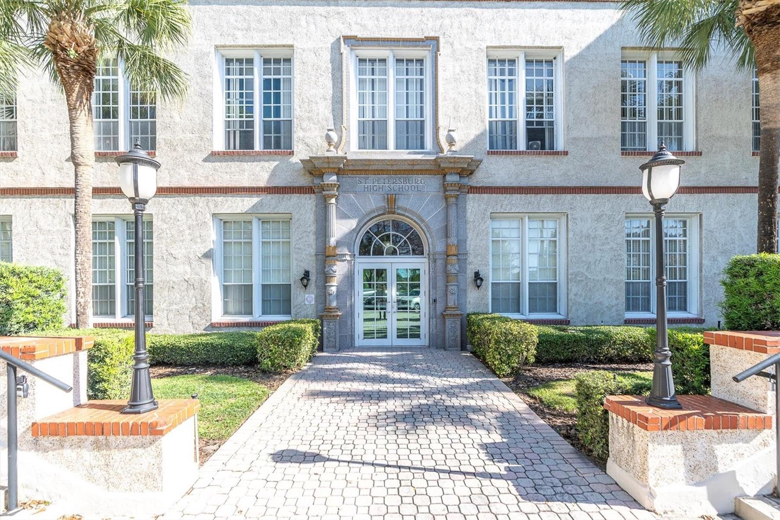 Front entry. Directly behind is Mirror Lake. The unit is just inside this door to the right on the back side of hall so looks out to courtyard. Stays private and quiet!
