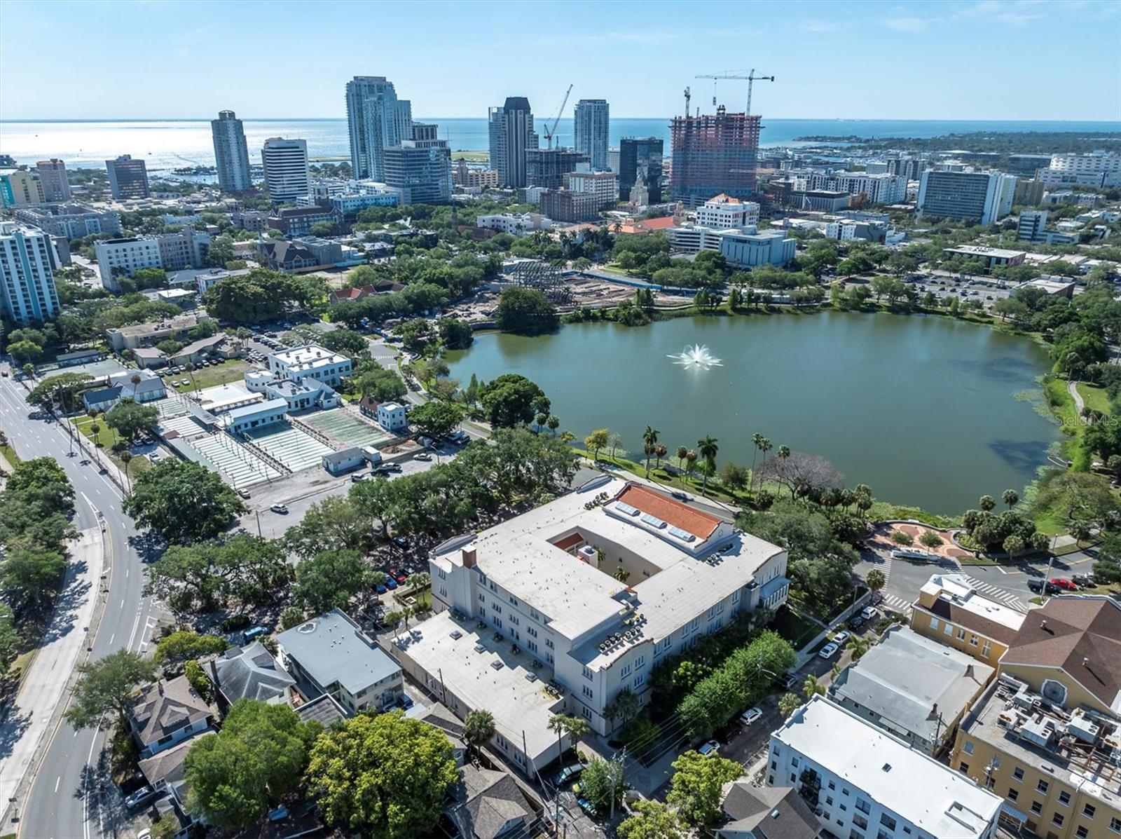 You are right at Mirror Lake! And the area on the left, a bit above the building - that's St Pete Shuffle - the shuffle board courts. Try it, it's very fun! The downtown skyline is just a few blocks away, and a tiny bit of The Pier shows, waters edge on left side