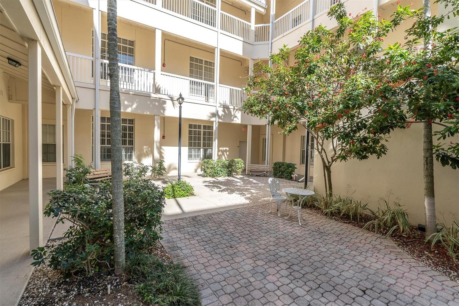 Courtyard has nice foliage and little spots for sitting