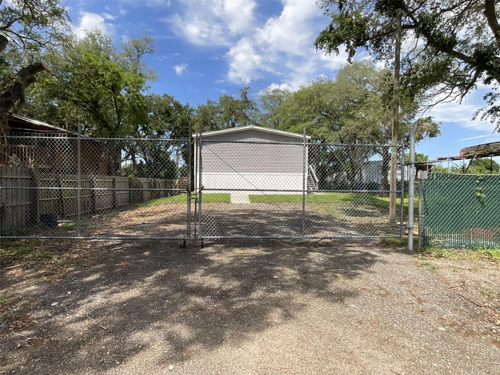 Extra wide double gate to get your hobbies and toys into the large backyard