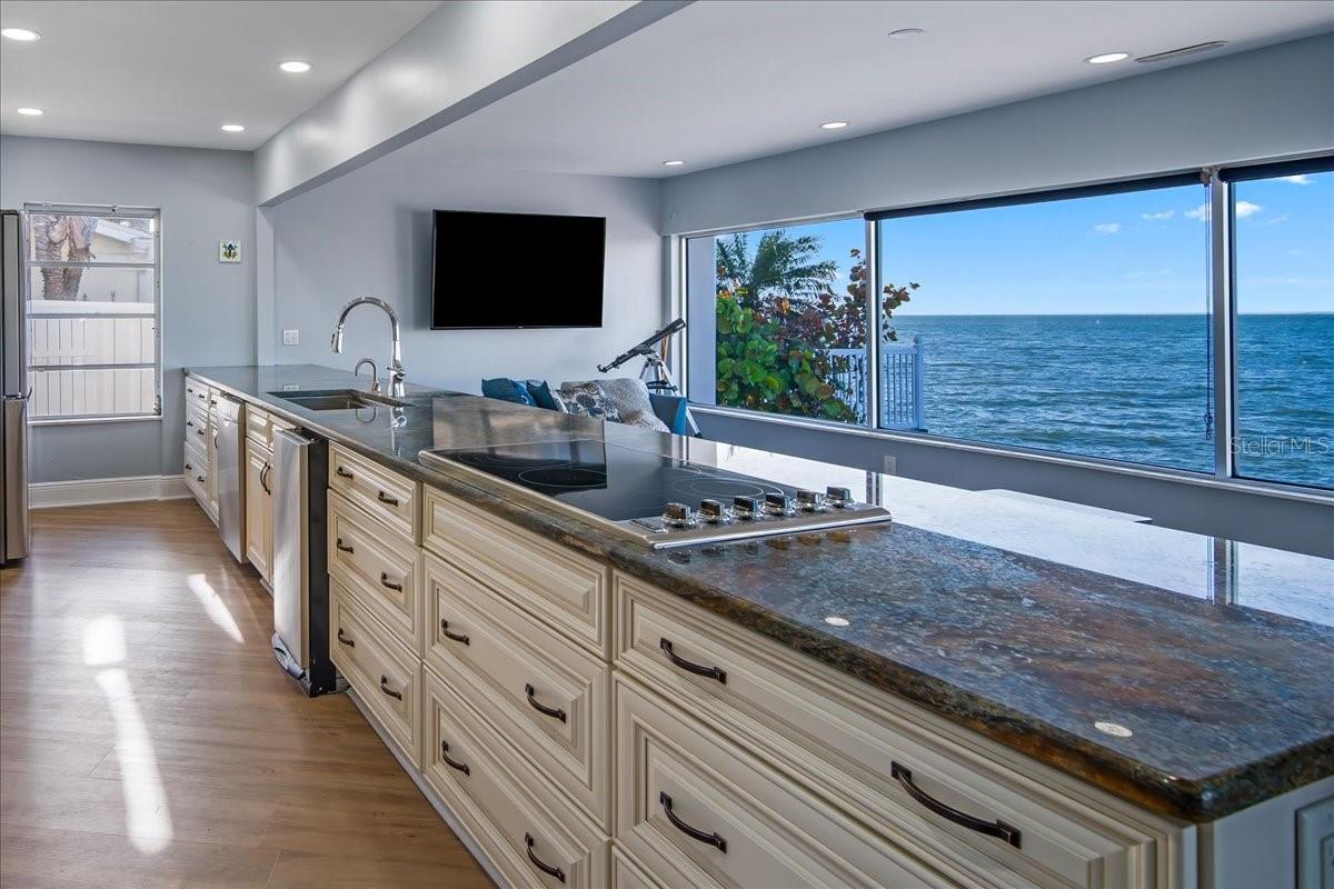 More viewpoints of this gourmet kitchen, illustrating the abundant space it offers and for entertainment and confronting views of the skyway bridge.