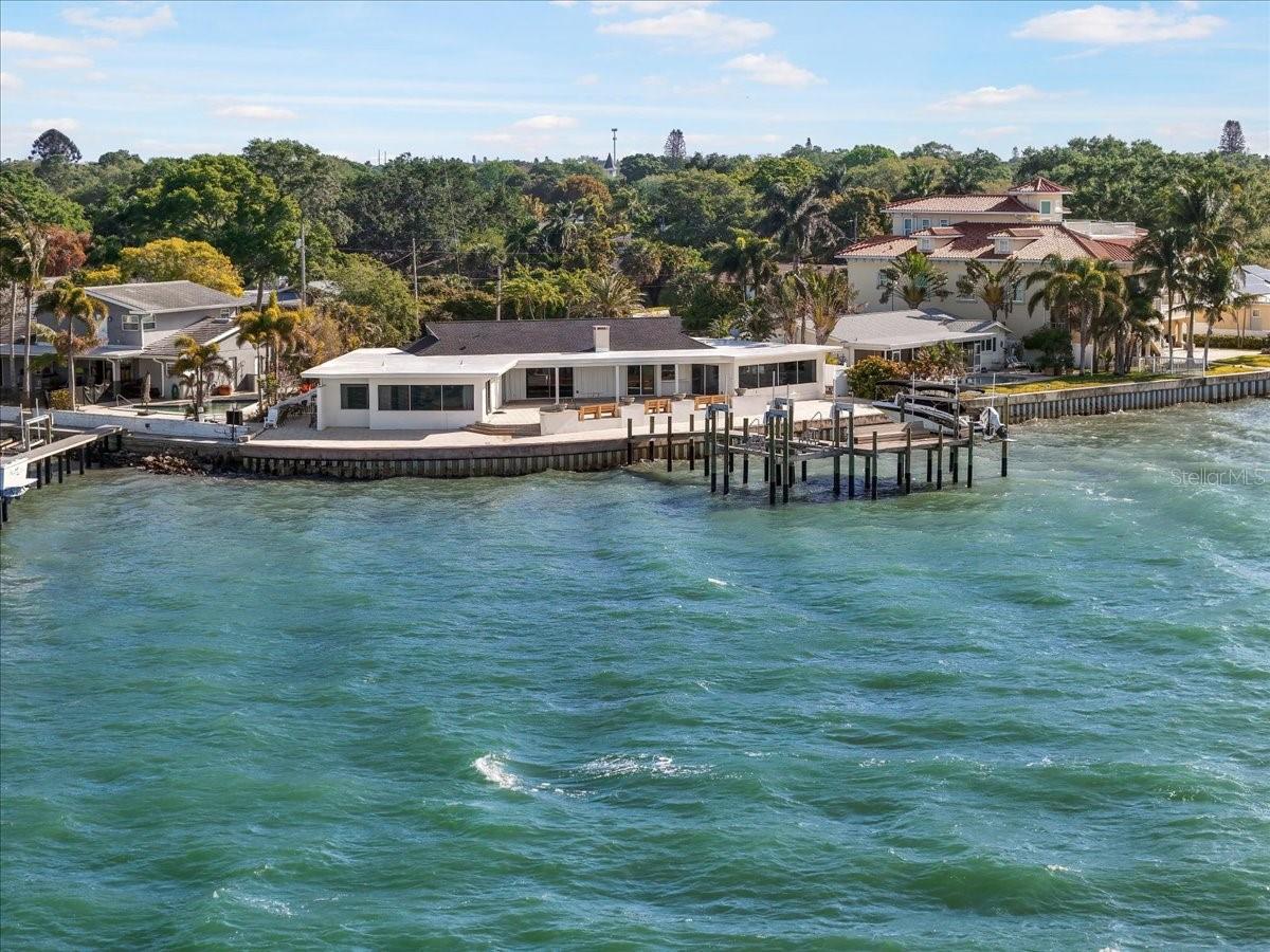 An aerial image captured from the waterside, providing a stunning view of this mesmerizing home.