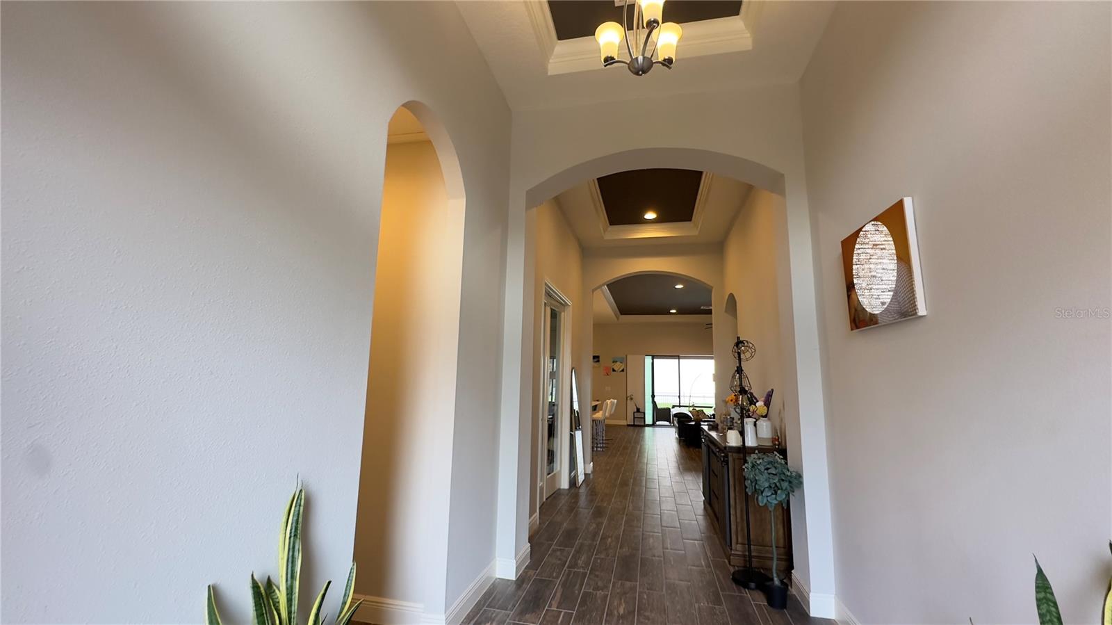 Upon entry, a stunning foyer makes an impressive statement