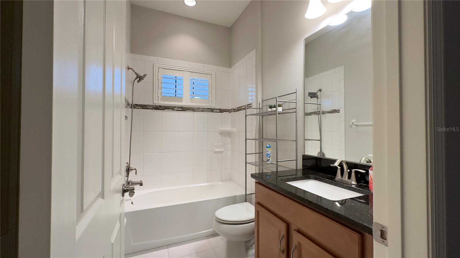 Bathroom #1, adjacent to Bedroom #1, is a full bath with tub/shower combo