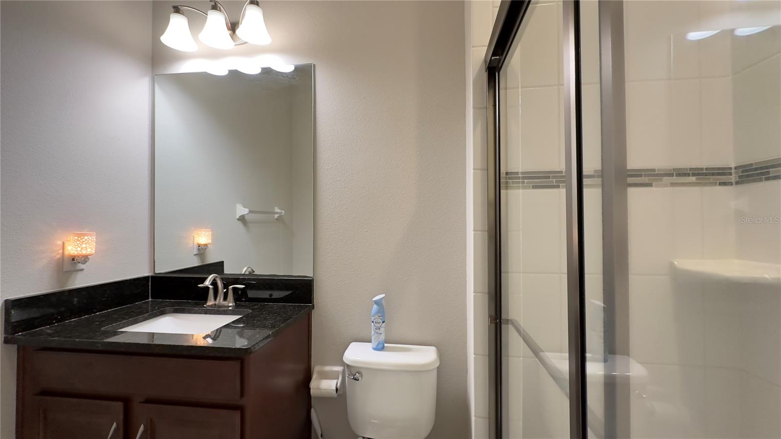 Full bath Bathroom #2 is conveniently adjacent to Bedroom #2, and luxuriously refreshes with granitecounters…