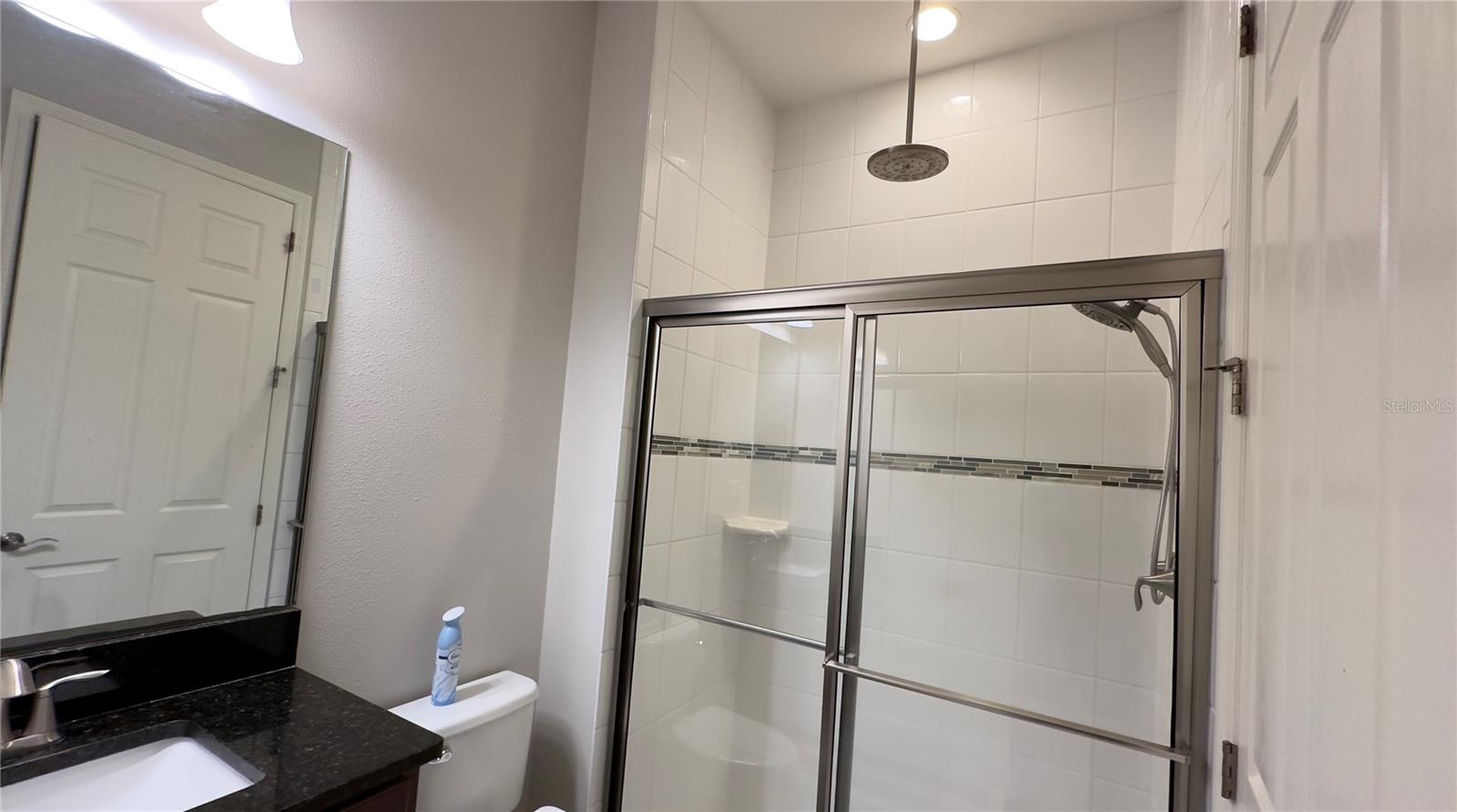 … and a walk-in shower with a combo rain showerhead and handheld shower