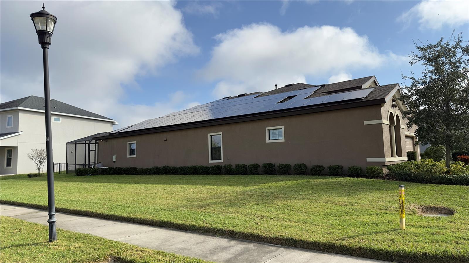 Solar panels further boost this energy efficient corner-lot home