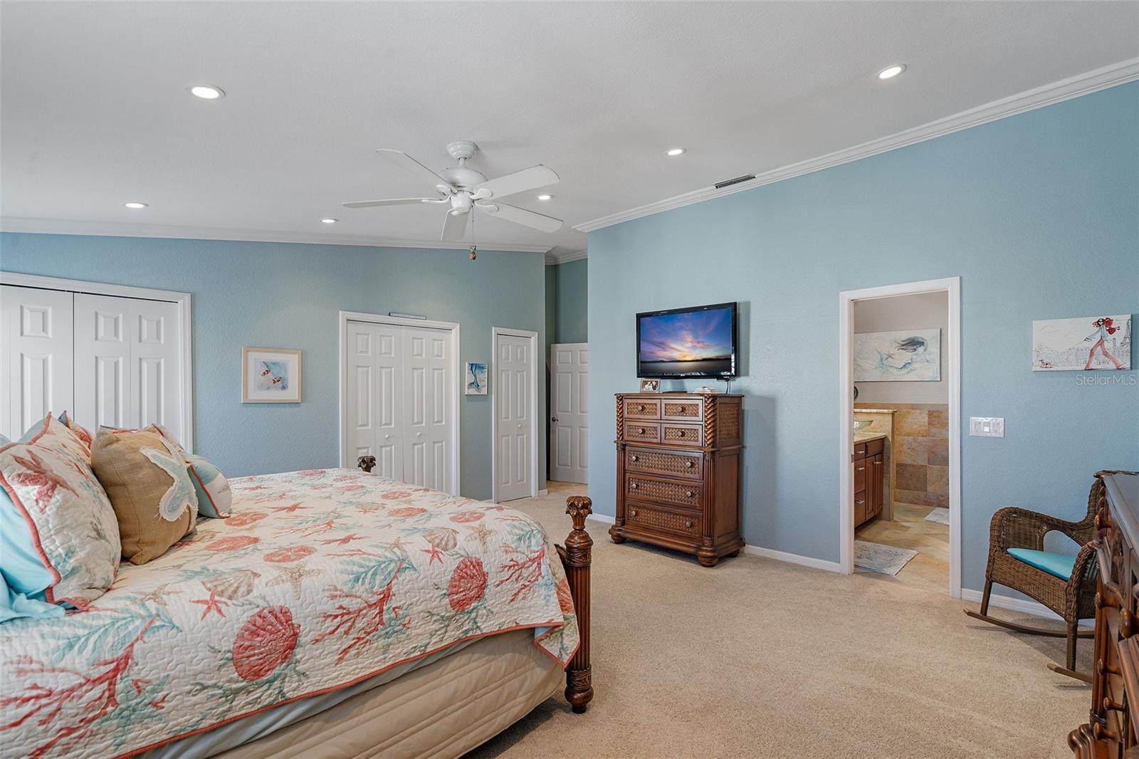 Large primary suite with bath and 3 closets and a linen closet.
