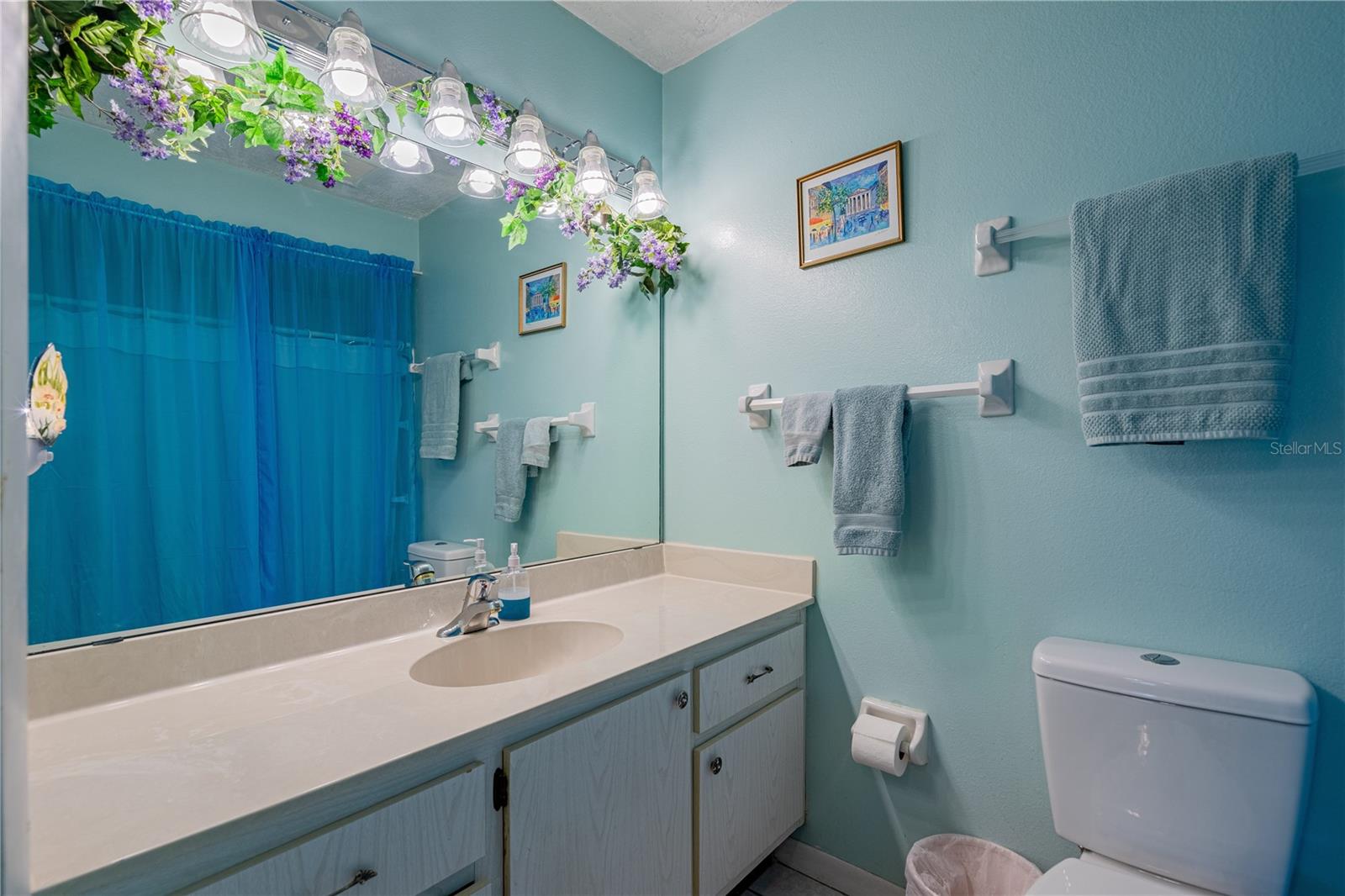 Large Master bath w/shower tub combo w/upgraded water efficient toilet.