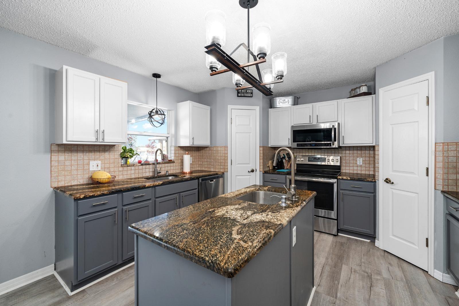 Kitchen with Granite Countertops and 2 sinks