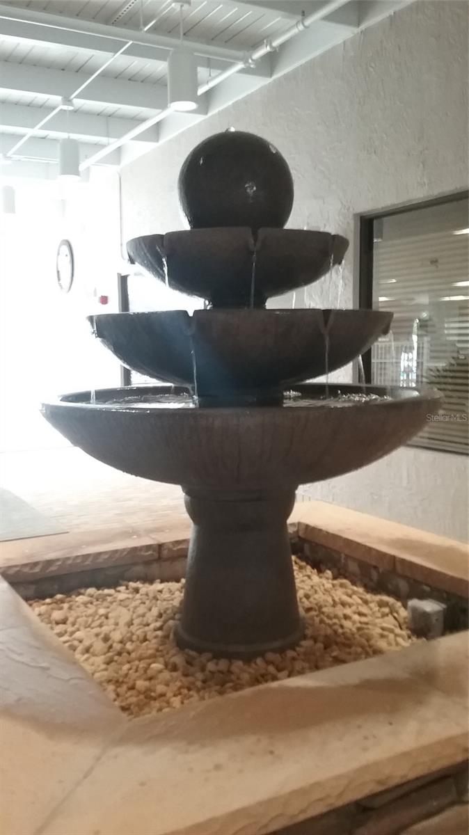 WATER FOUNTAIN IN ENTRY TO CLUBHOUSE HALLWAY.