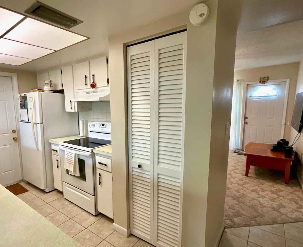Kitchen pantry, range and refrigerator area