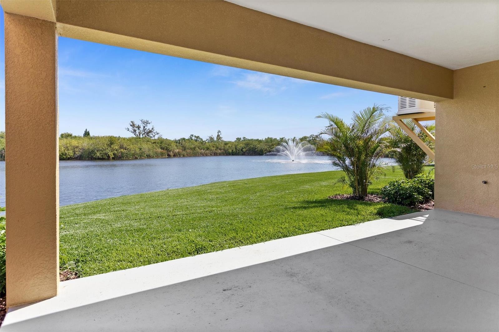 Overlooking lagoon and preserve under covered terrace.