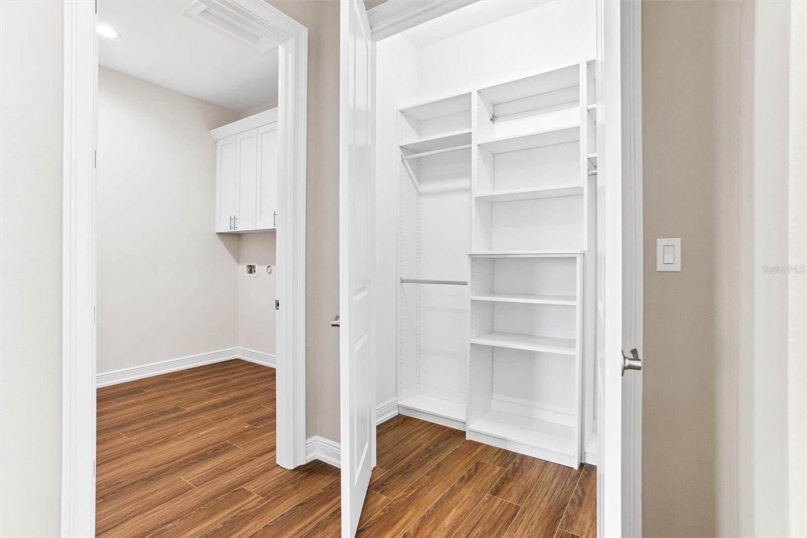 Extra-large hall closet next to huge Laundry room door on left.