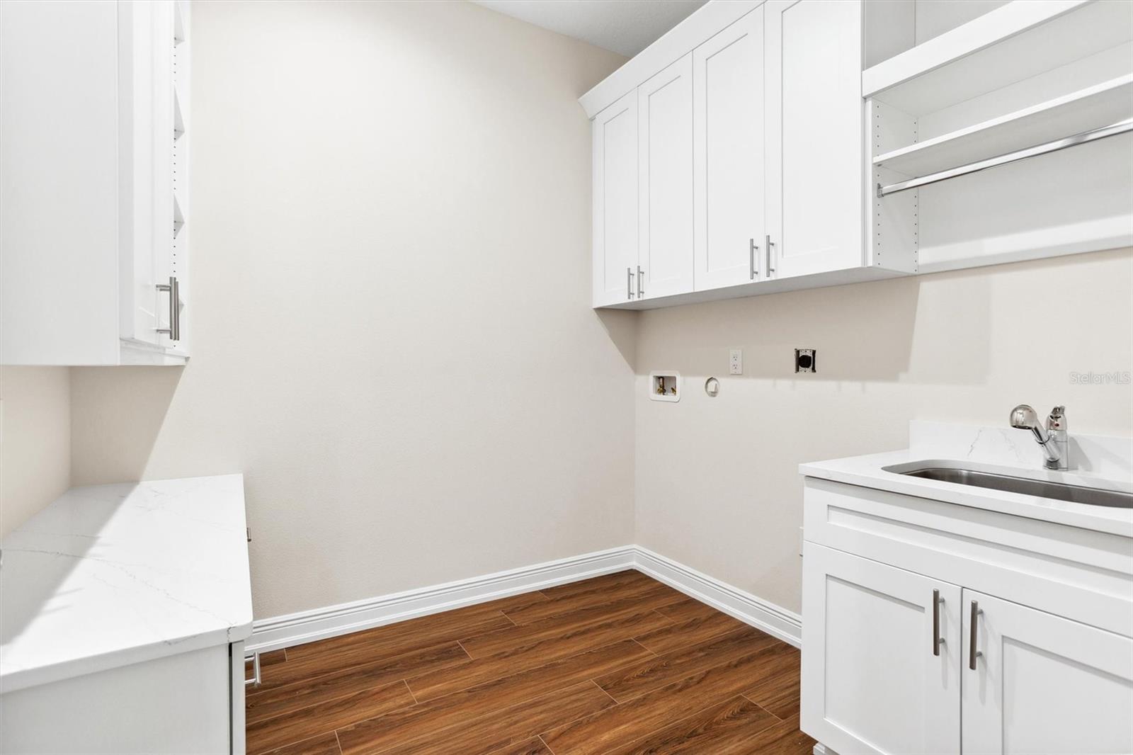 Laundry Room with custom built in cabinets including desk area.
