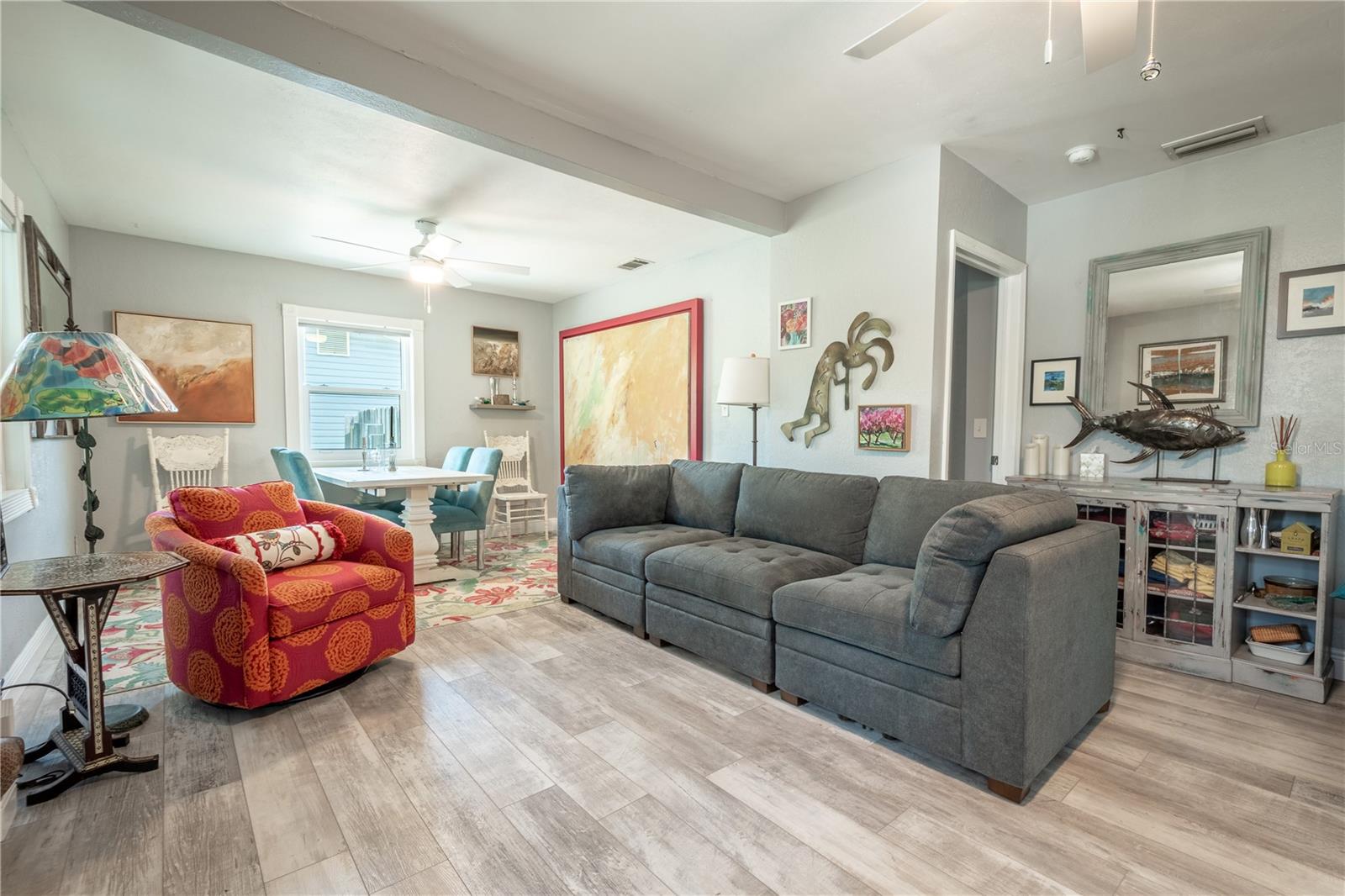 The living and dining rooms feature luxury vinyl floors and ceiling fans for year round comfort.
