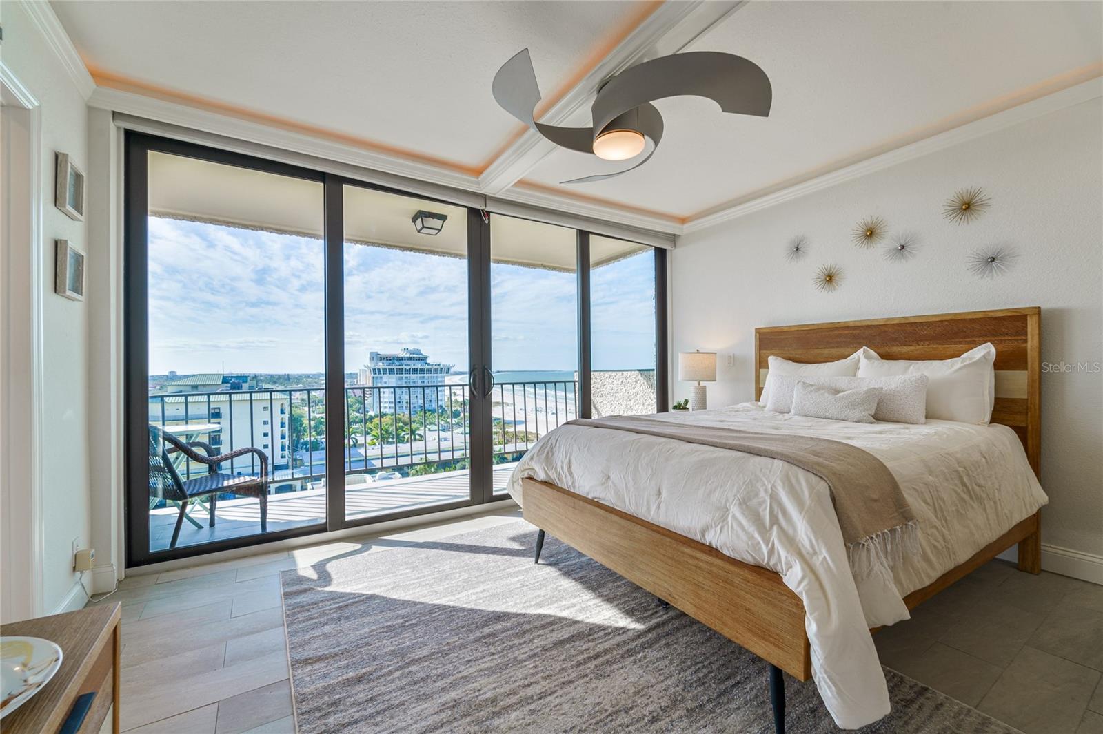Guest bedroom with balcony facing south. Gorgeous beach & ocean views.