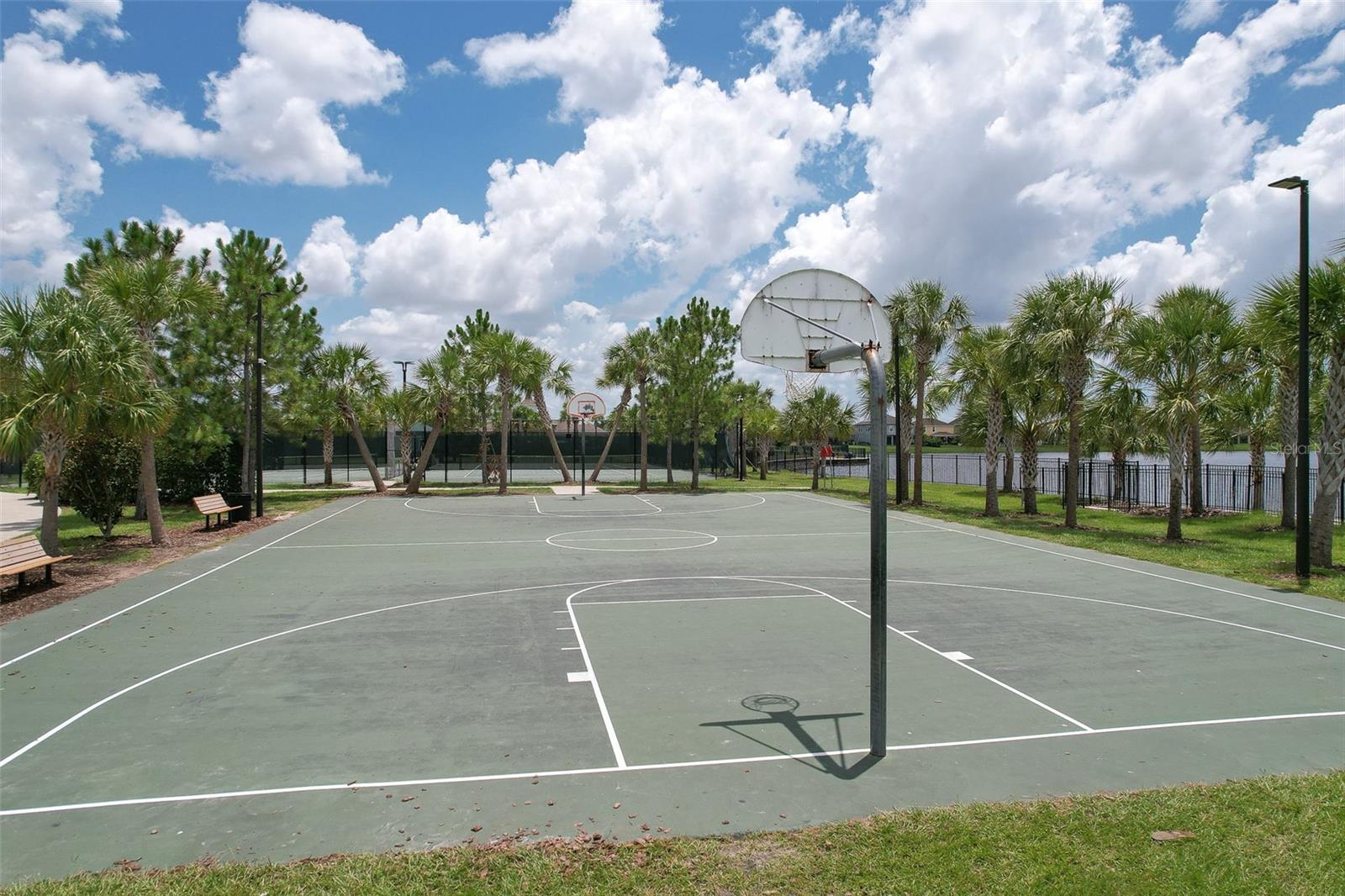 Basketball court near pond at the community center.
