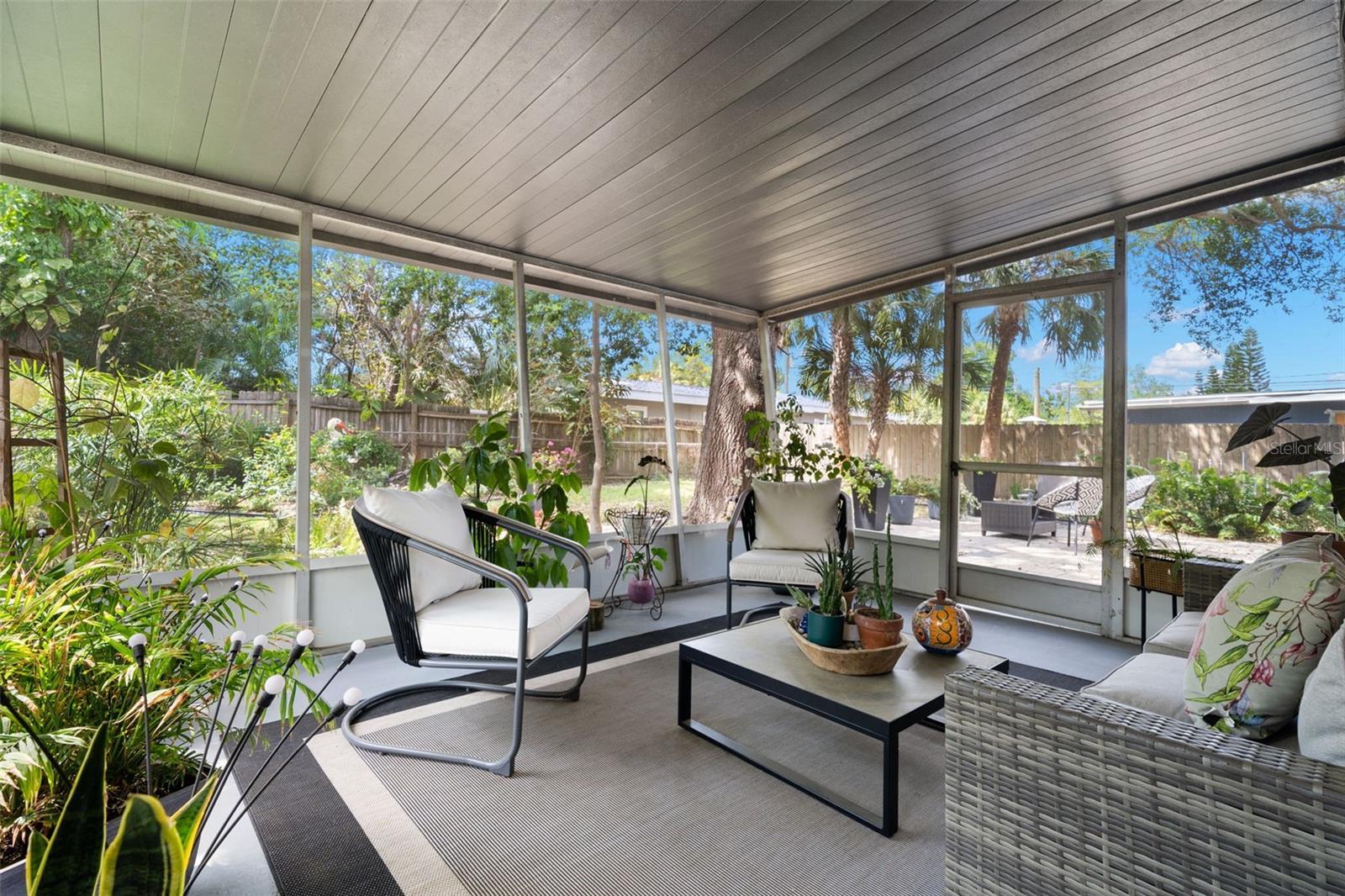A beautiful screened lanai overlooking a peacefully landscaped oasis.