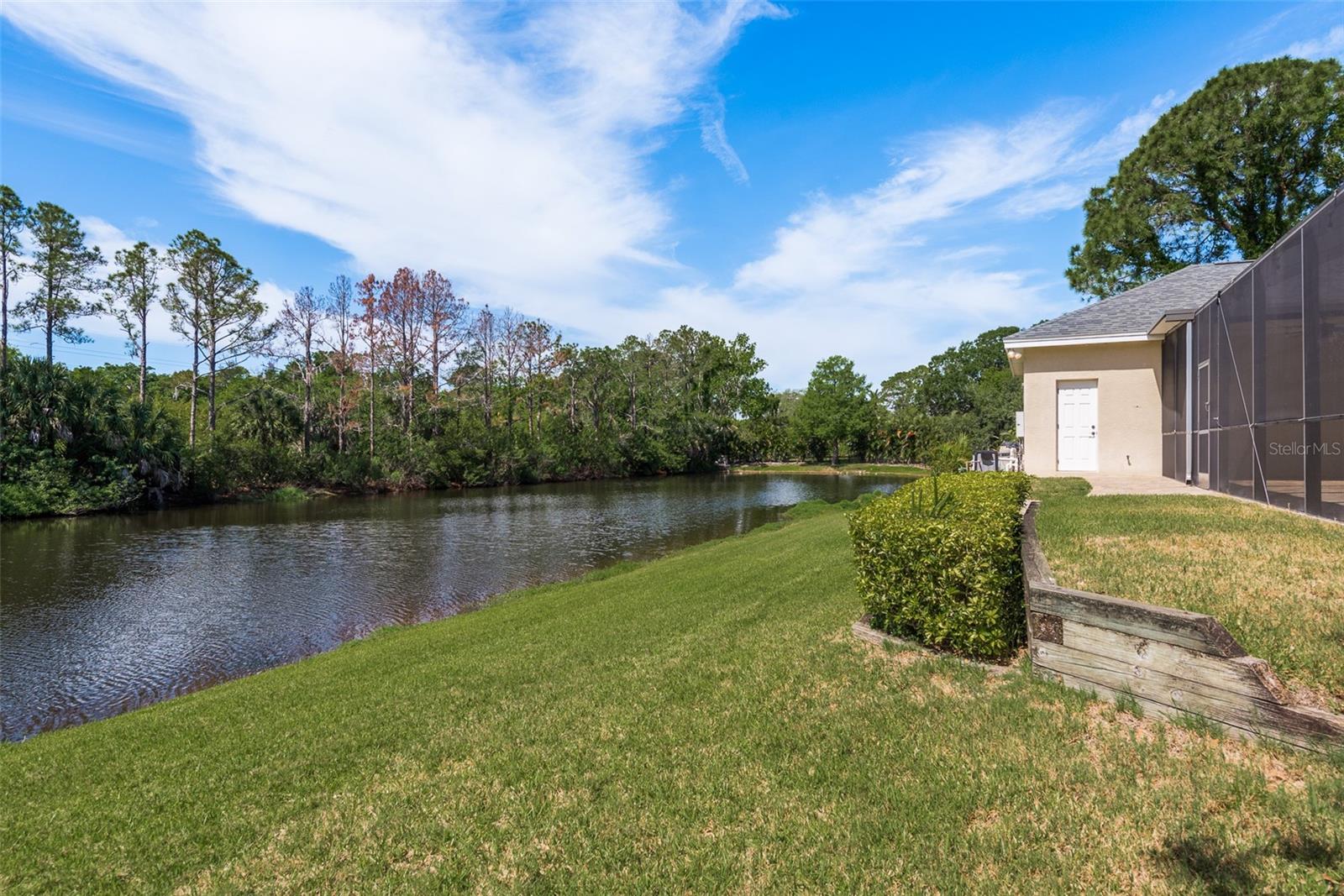 Enjoy the serene beauty of the pond, a tranquil centerpiece of natural splendor that enhances the ambiance of your outdoor space, providing a peaceful retreat where you can connect with nature and unwind in serenity.