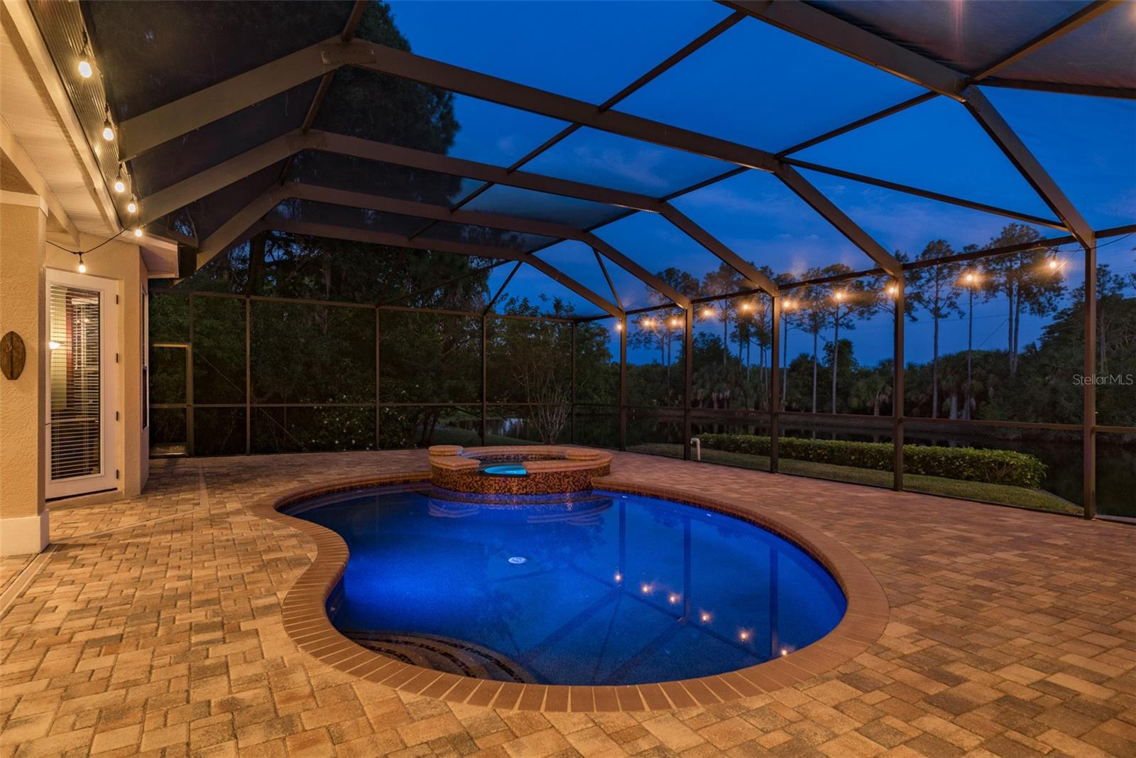 Capture the allure of your pool and spa in twilight photos, where the ambient lighting illuminates the shimmering water and casts a serene glow over the luxurious amenities, creating a captivating scene that invites you to unwind and indulge in the ultimate relaxation experience amidst the tranquil setting of your backyard oasis.