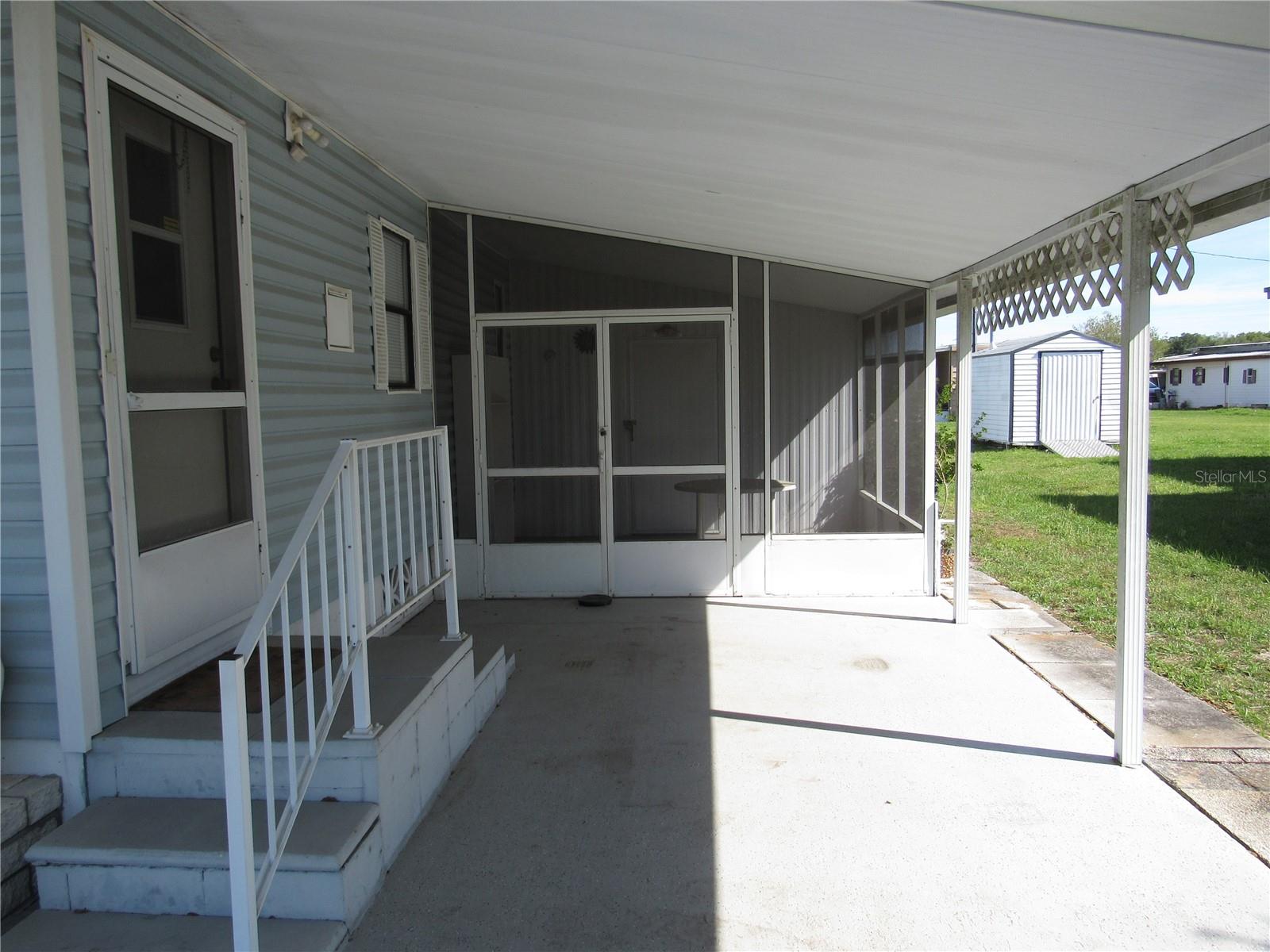 Main entry & attached screen porch.
