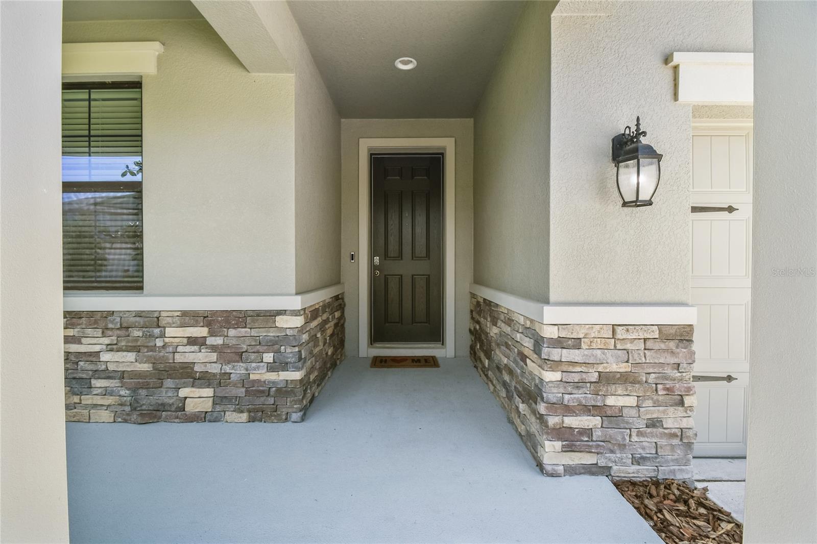 Entrance from inside w/alcove on left to laundry/garage doors