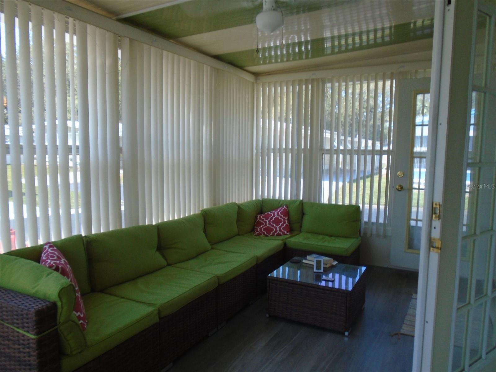 Light, Bright and Air Conditioned Florida Room has French Doors to the Main House
