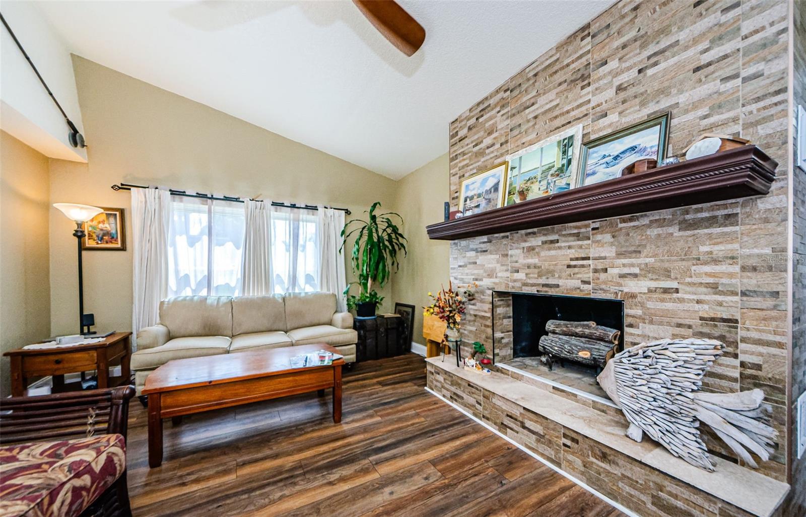 Family Room with Wood Burning Fireplace & Mantle