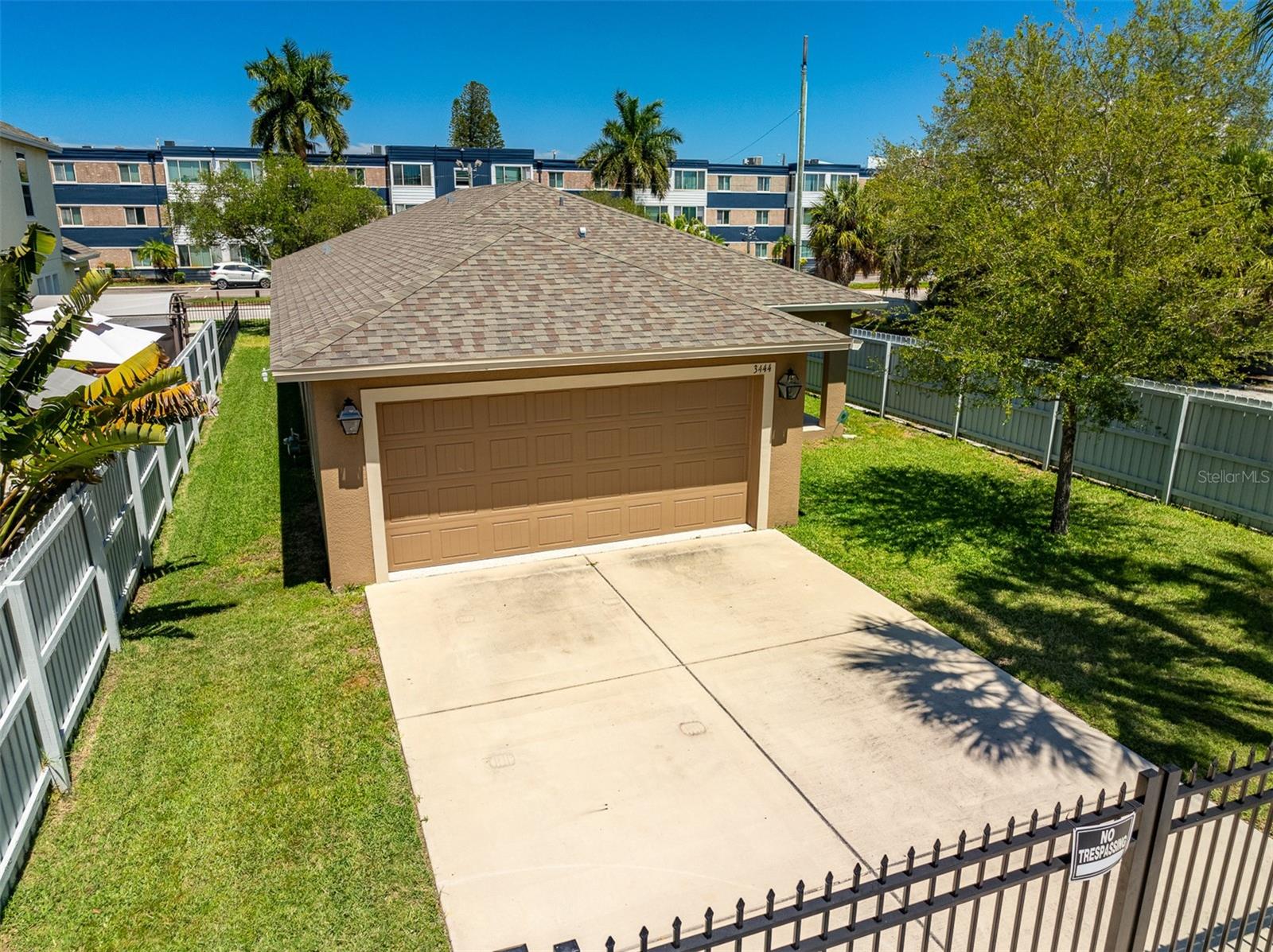 Spacious 2-car garage with gated access and 4 car parking pad accessible from rear alley