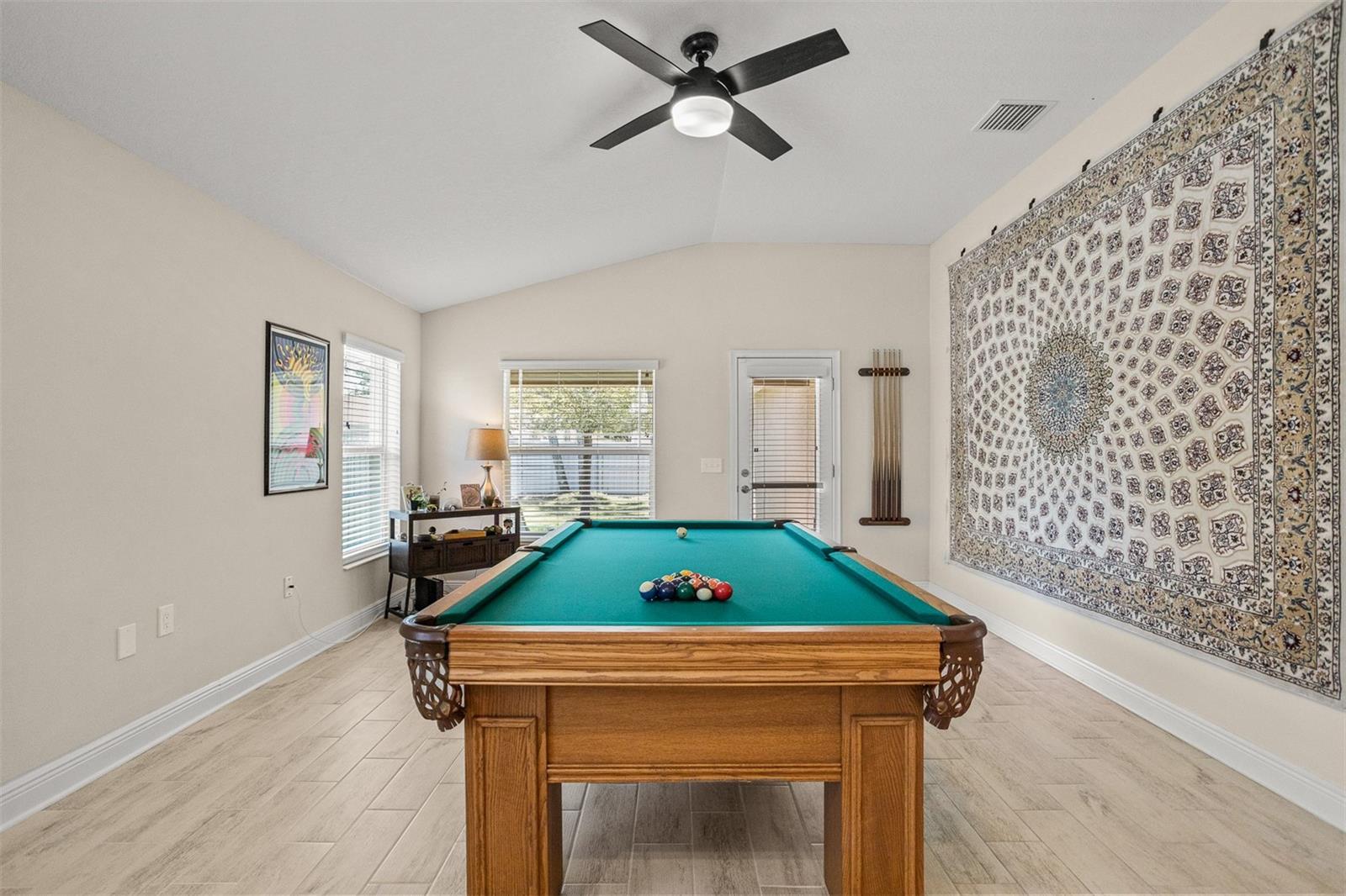 Oversized living room with plenty of space for entertaining, or even playing pool!