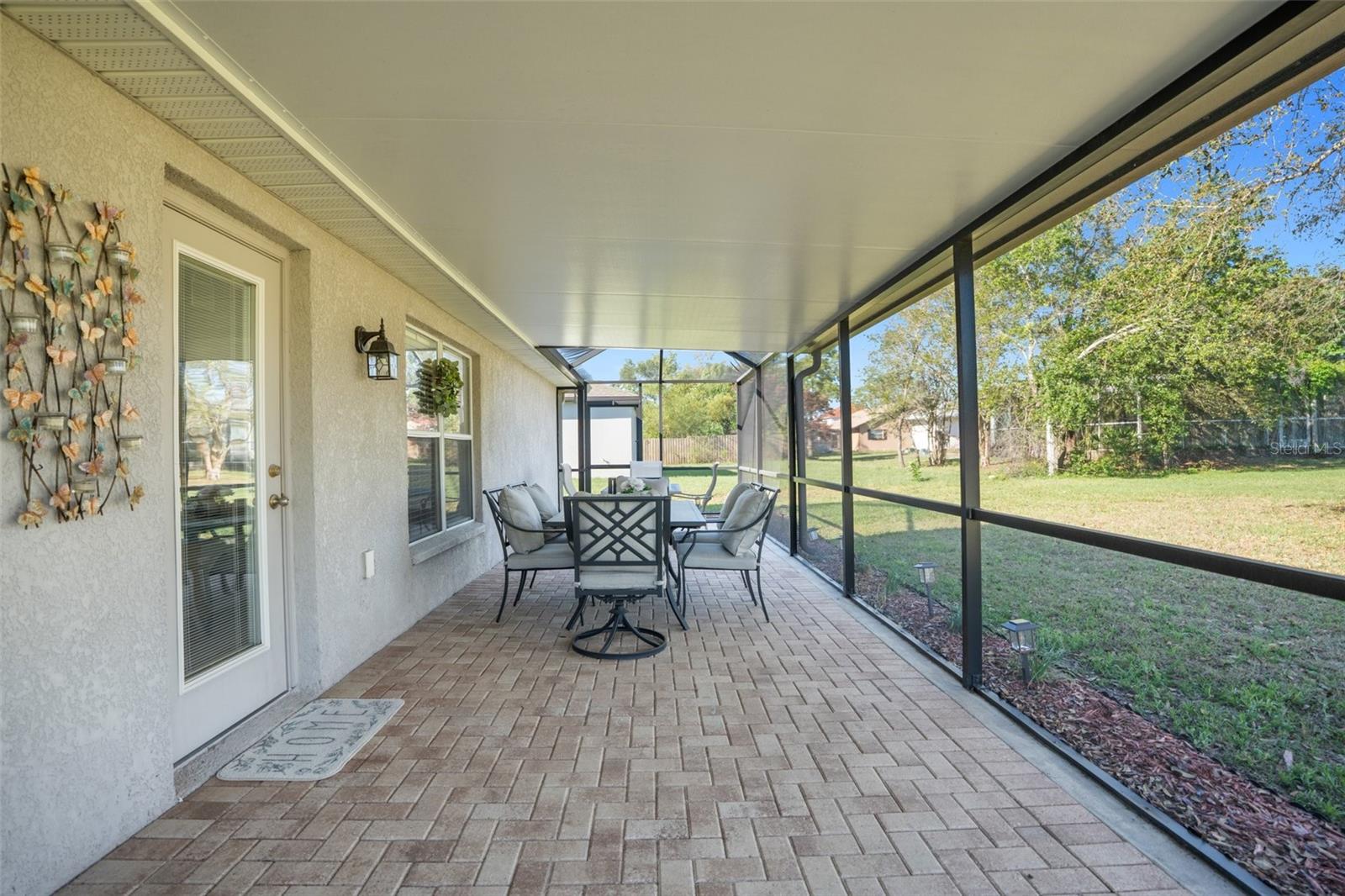 Love the Back Pavered Screened Porch