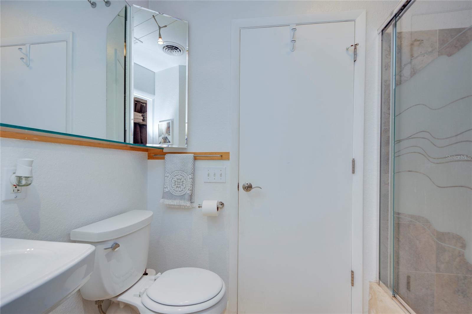 Hallway Bathroom with walk-in shower (pocket door attaches bathrooms)
