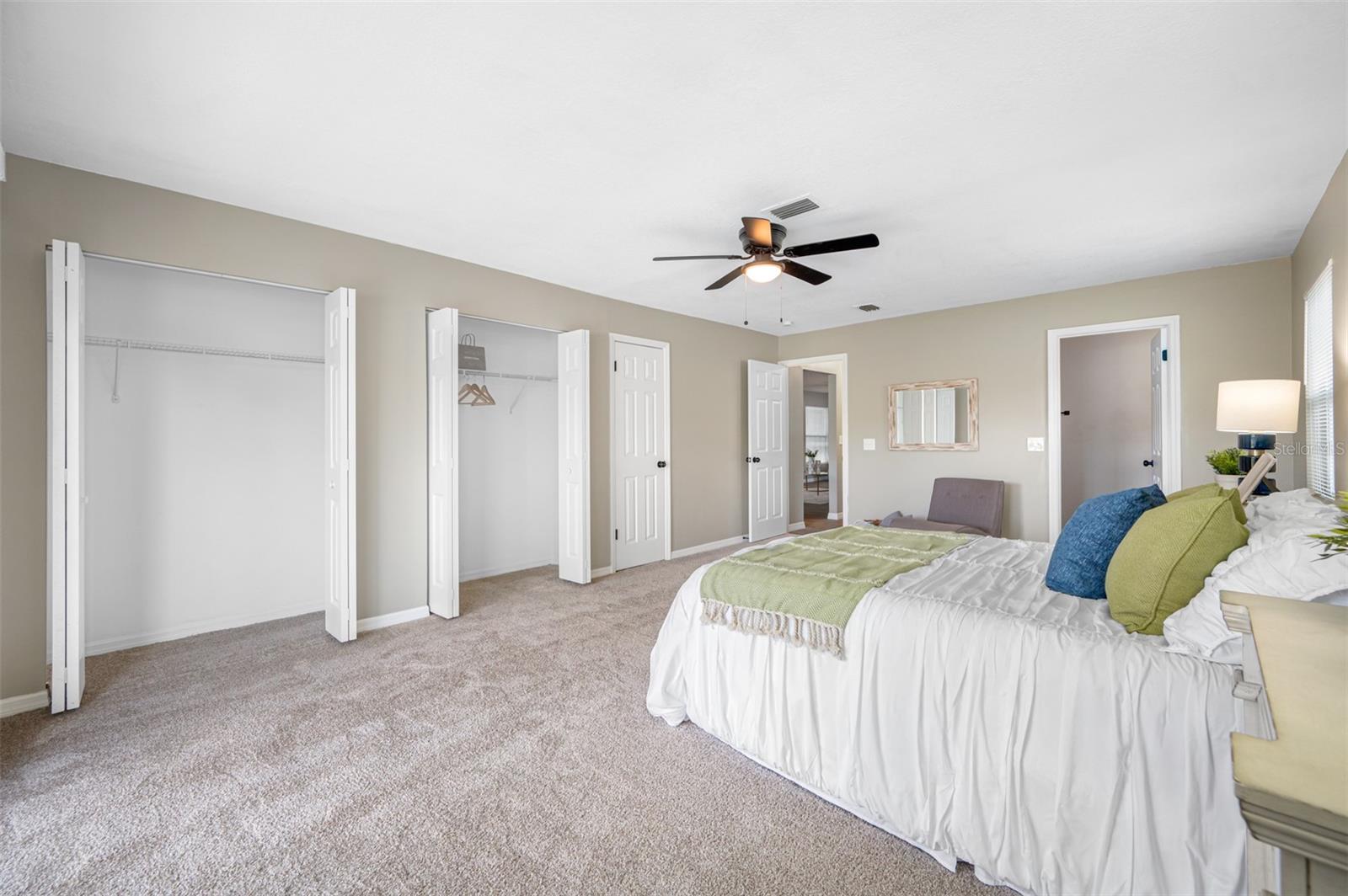 Spacious master bedroom with large closets