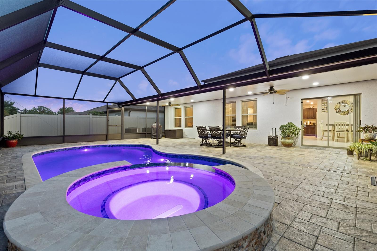 Beautiful covered patio and caged pool area
