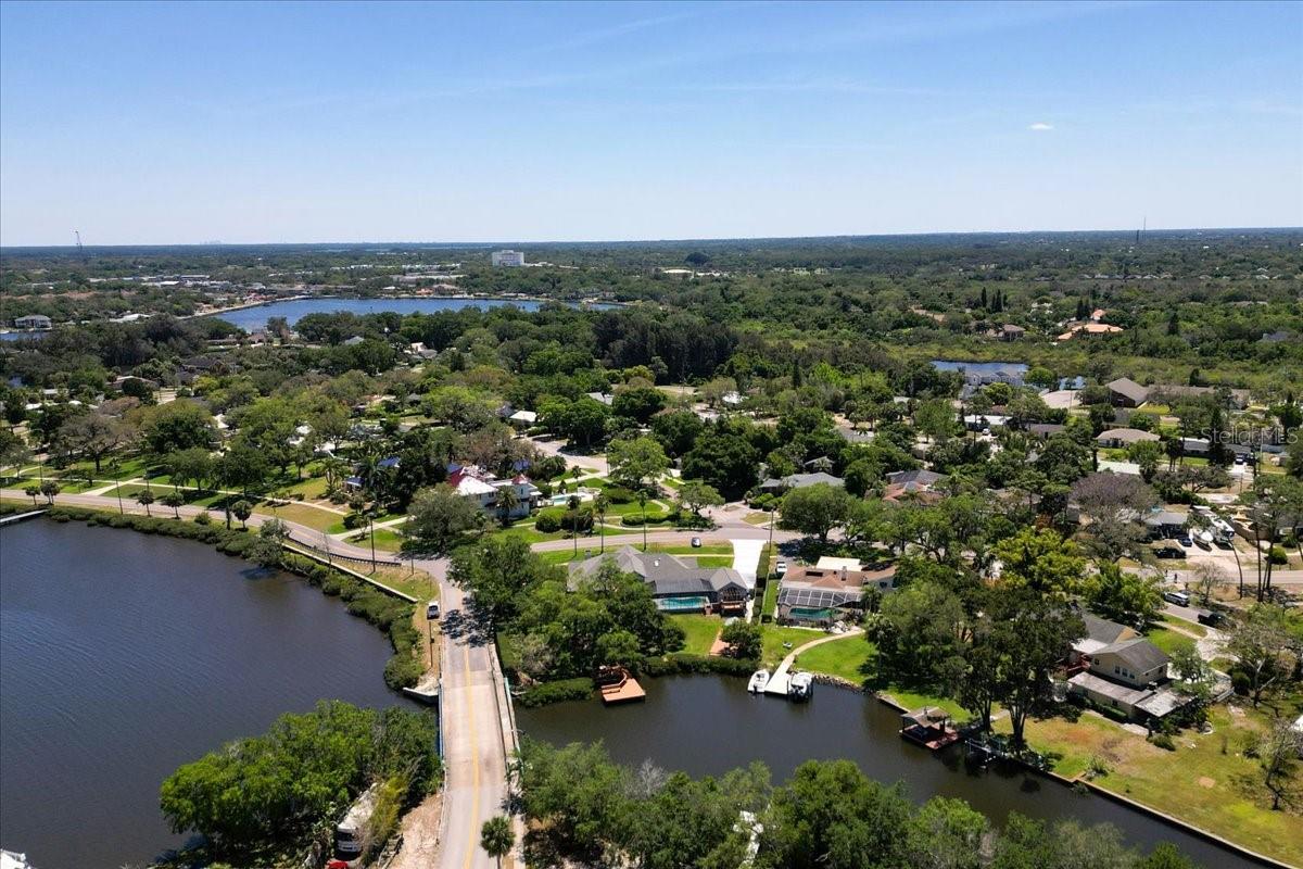 Aerial view of rear of home with canal and bayou