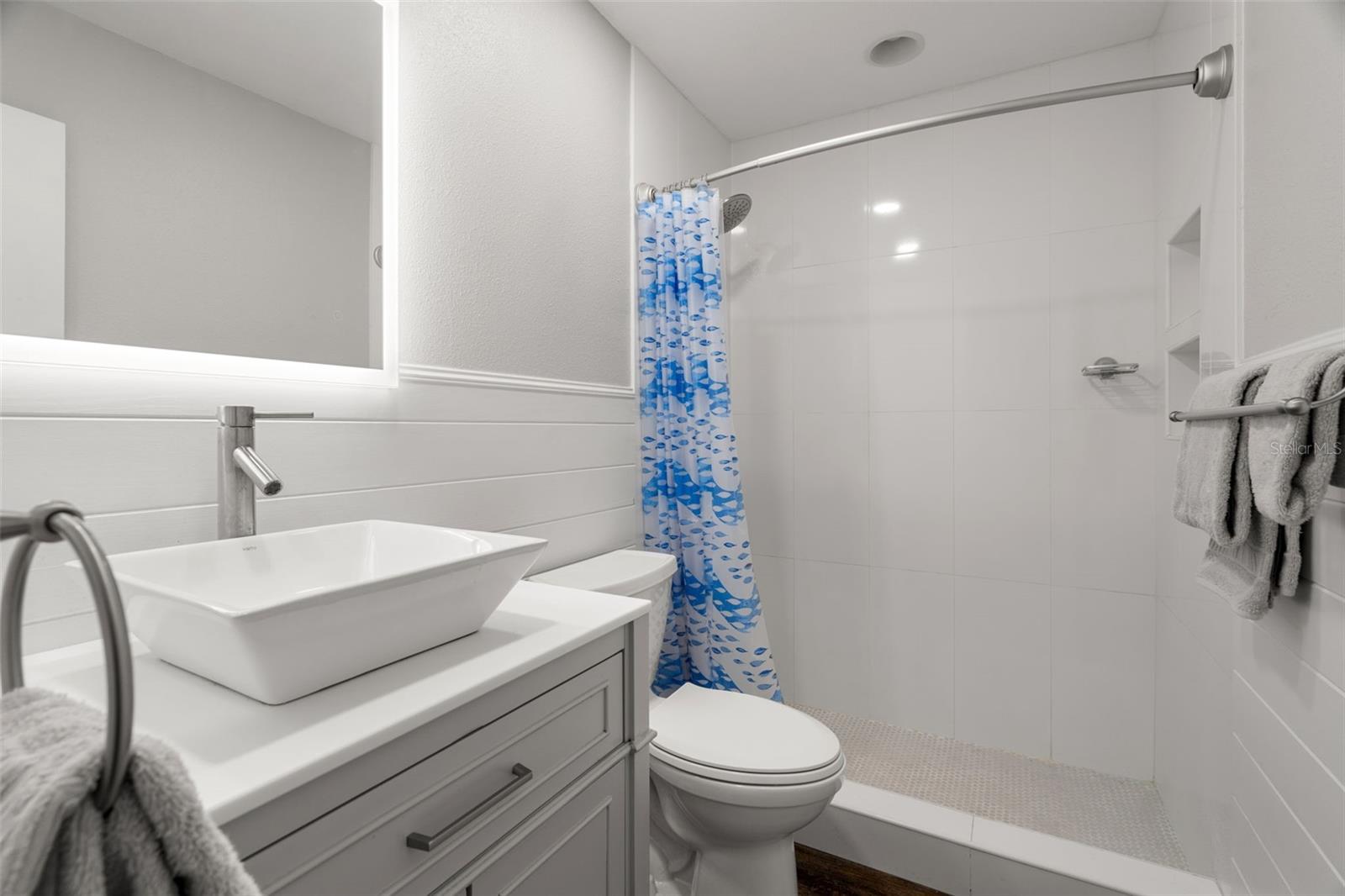 This beautifully updated bathroom is conveniently located just outside the primary bedroom.