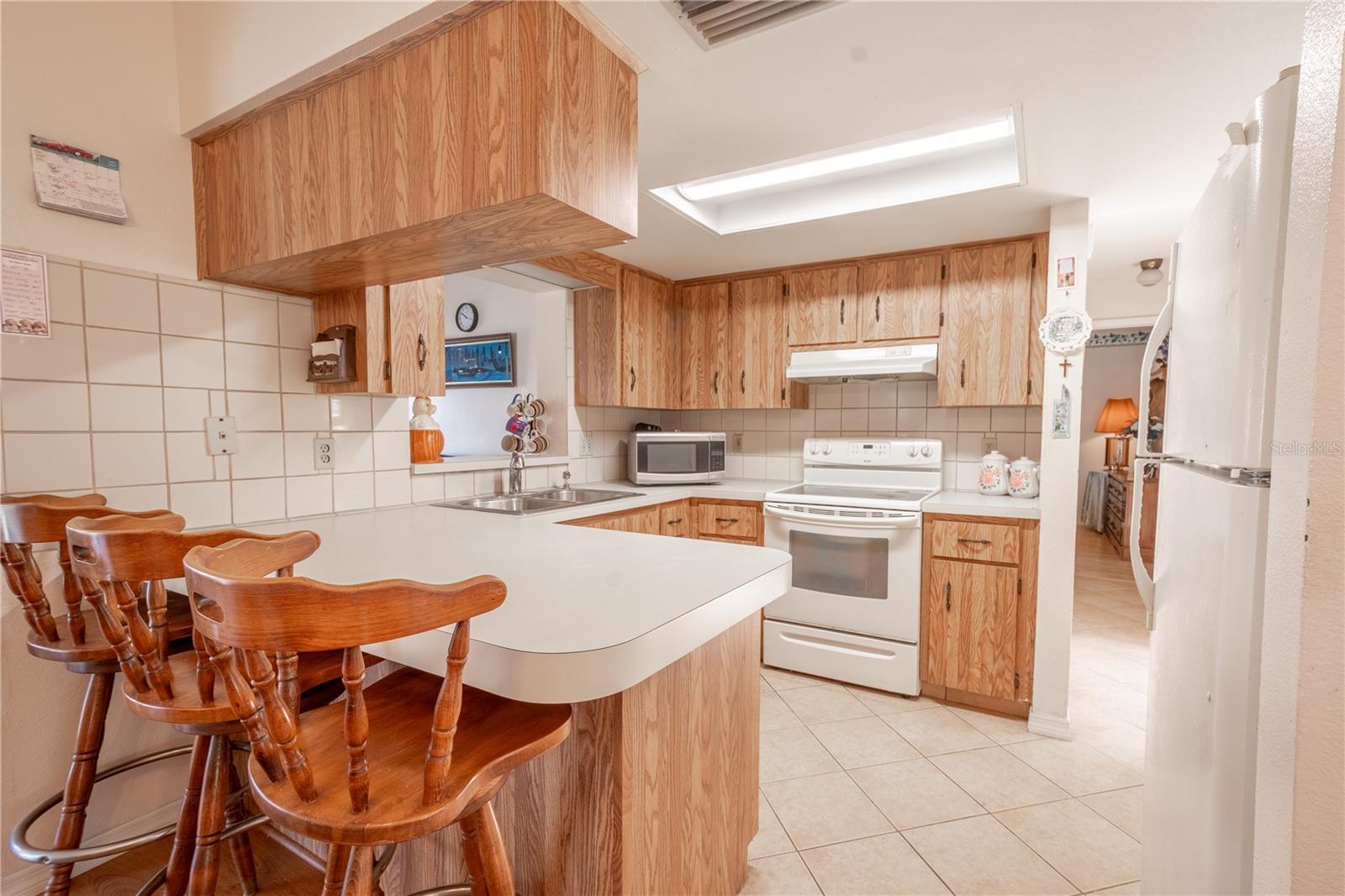 The kitchen offers plenty of counter space and a breakfast bar that seats 3.