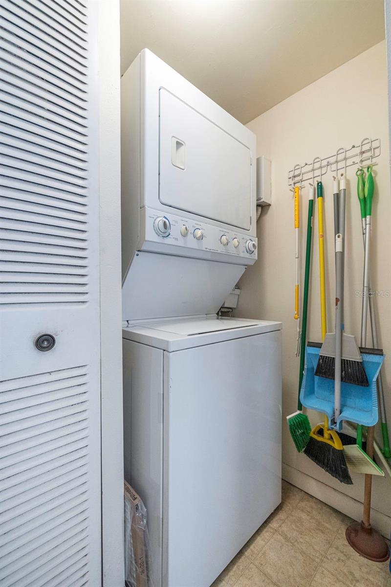 THE TANKLESS HOT WATER HEATER IS ON THE RIGHT WALL NEXT TO THE DRYER