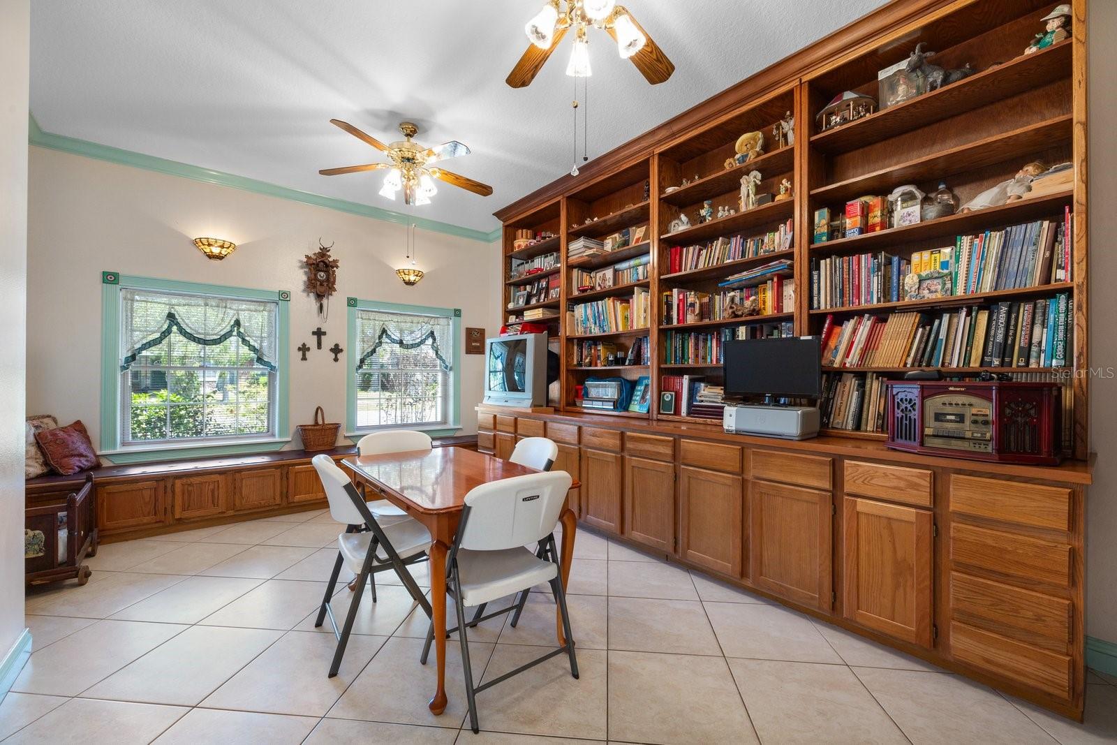 Den/Library with Wood cabinets /book shelves