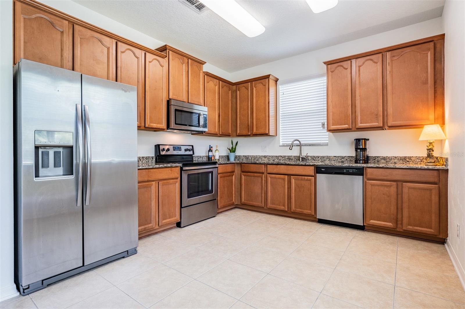 Wood Cabinets, Granite counters & Stainless steel appliances