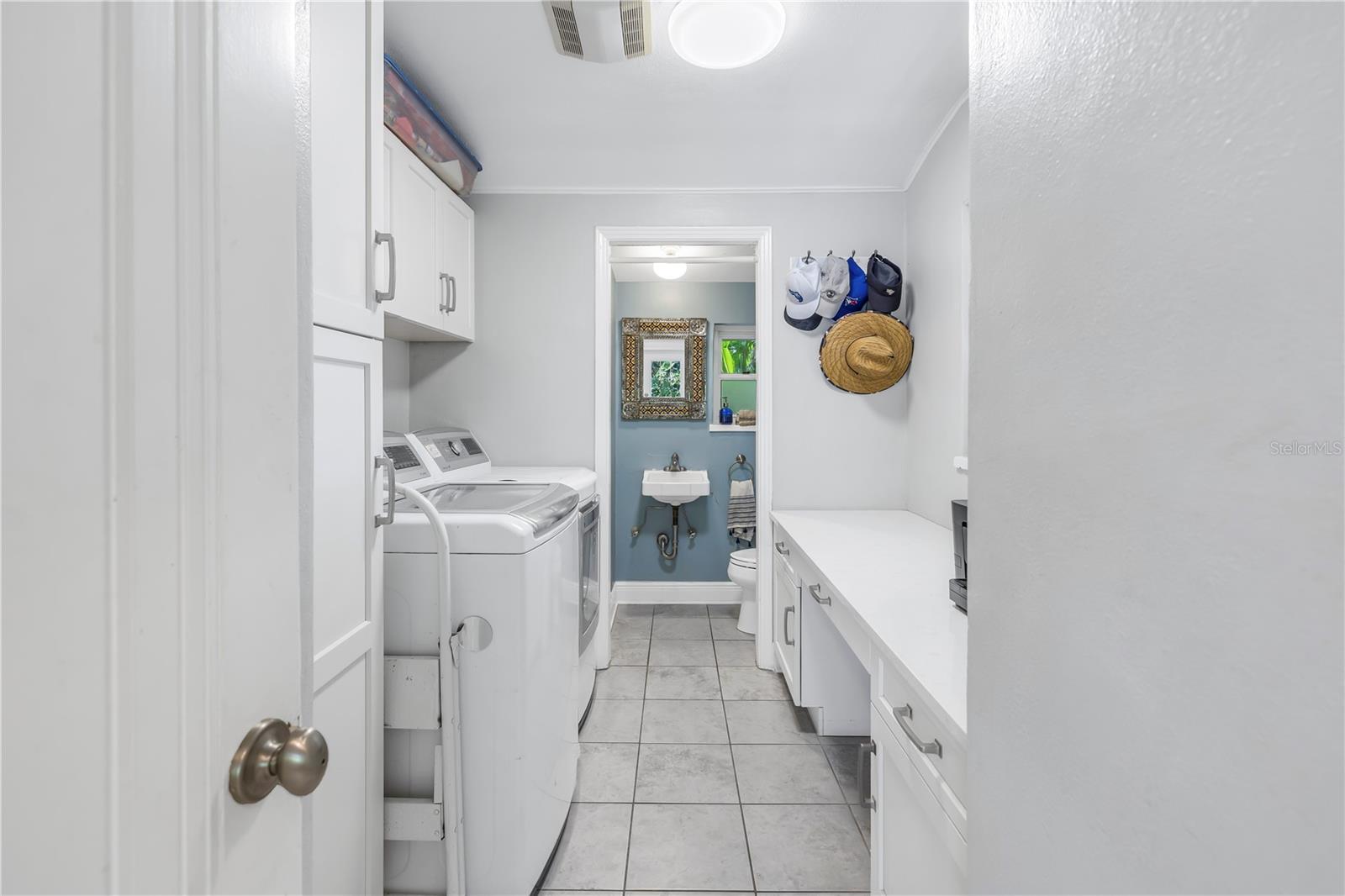 Laundry room with built in desk