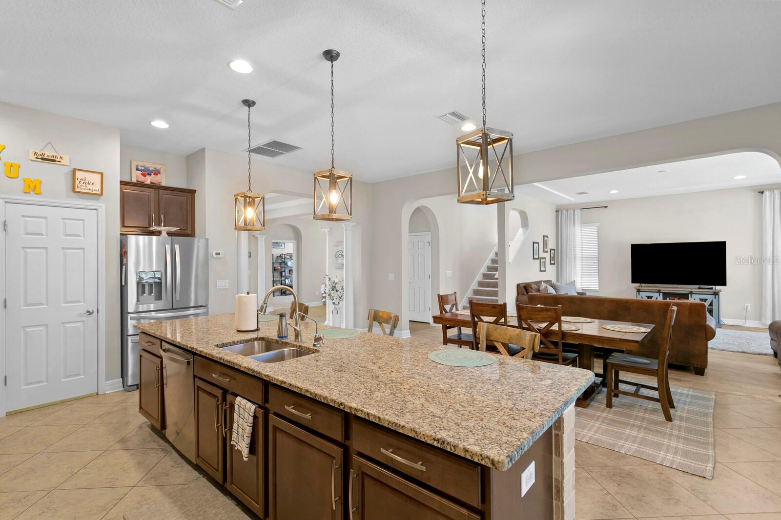 Enjoy entertaining in your kitchen with full view of the living room.