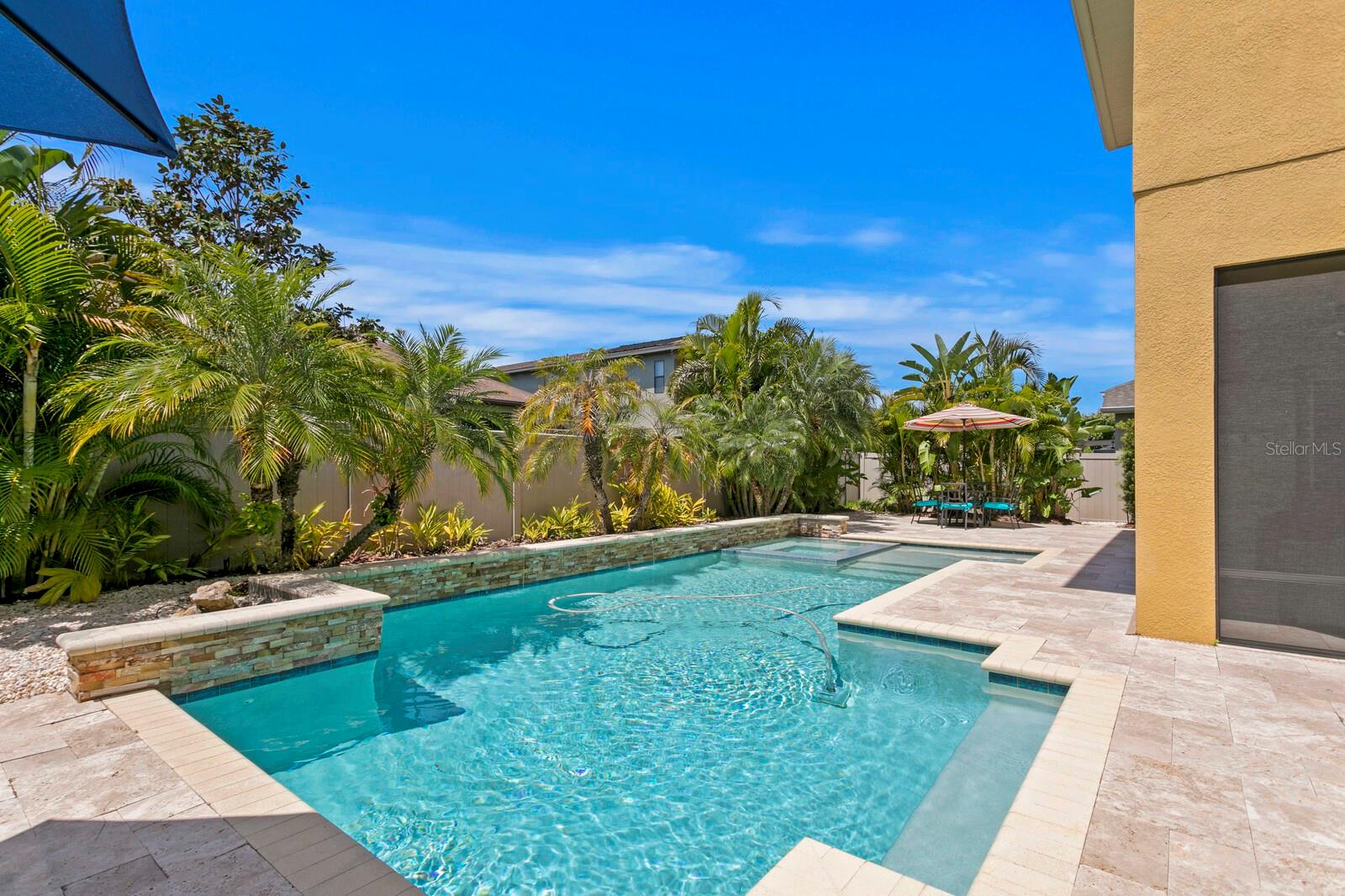 The light this pool catches keeps it warm & makes it a great open outdoor oasis.