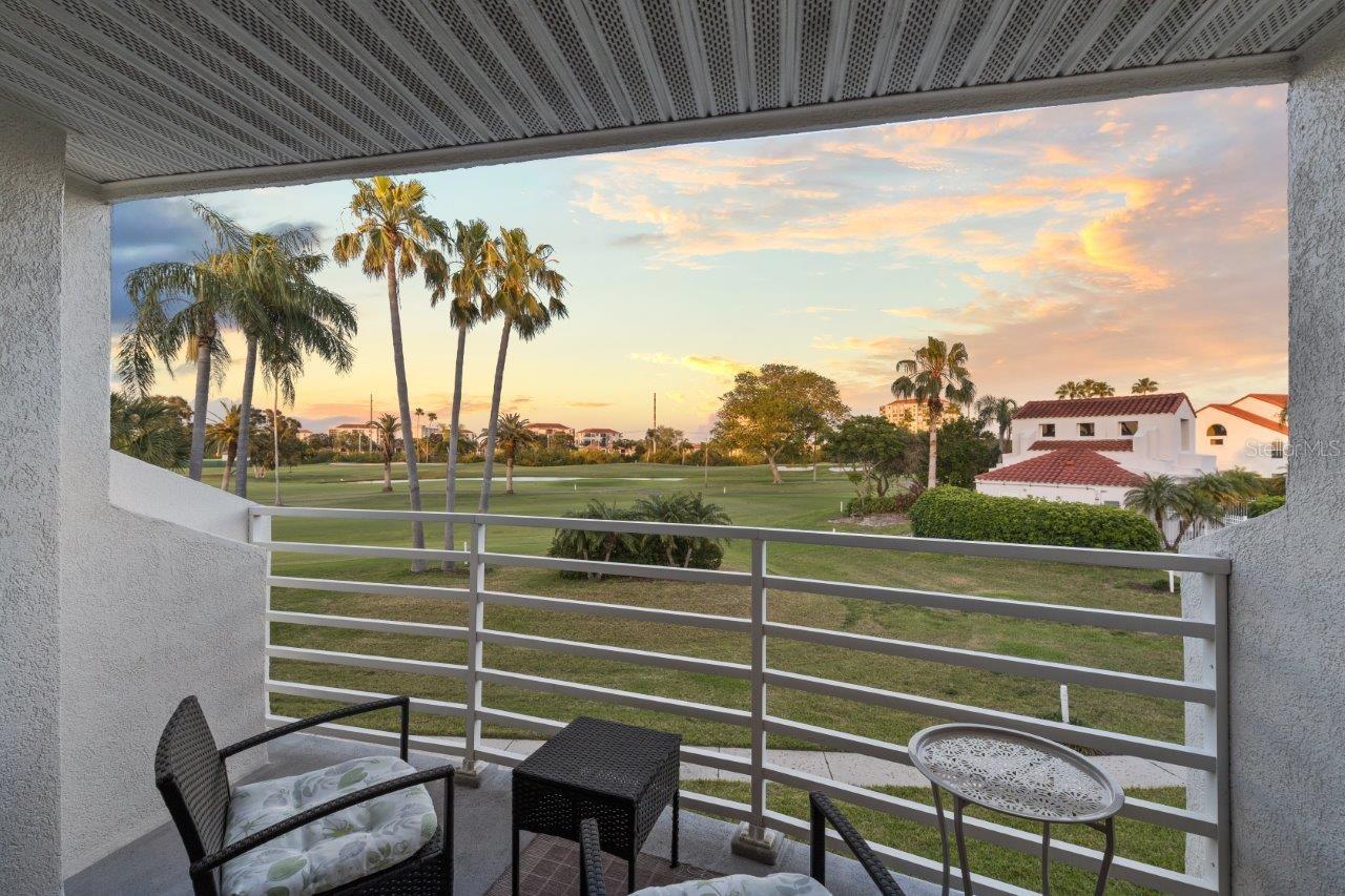 Covered Lanai with water, golf, and community pool views.